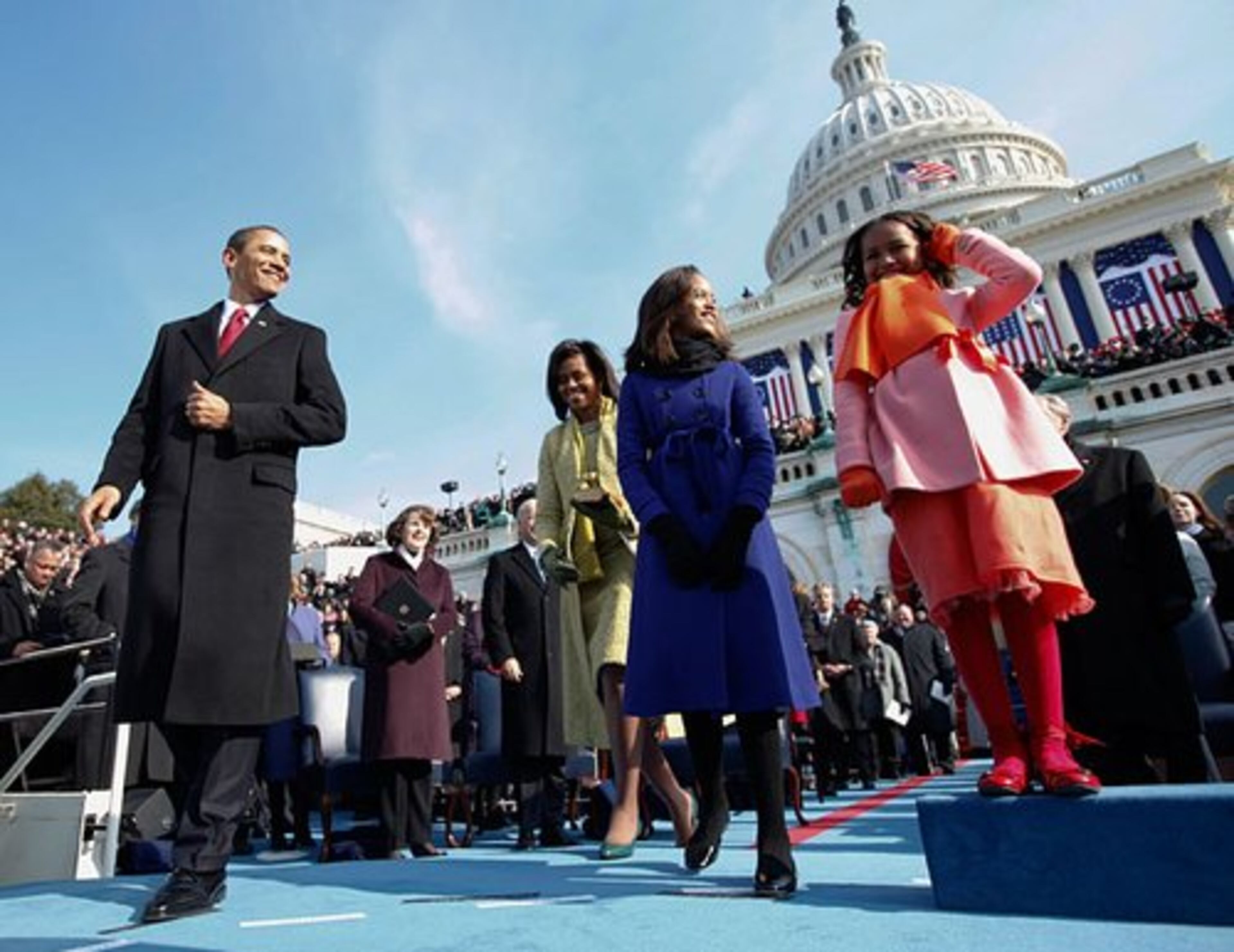 Obama, wife Michelle and their daughters, Malia and Sasha, approach the podium for his swearing-in ceremony.