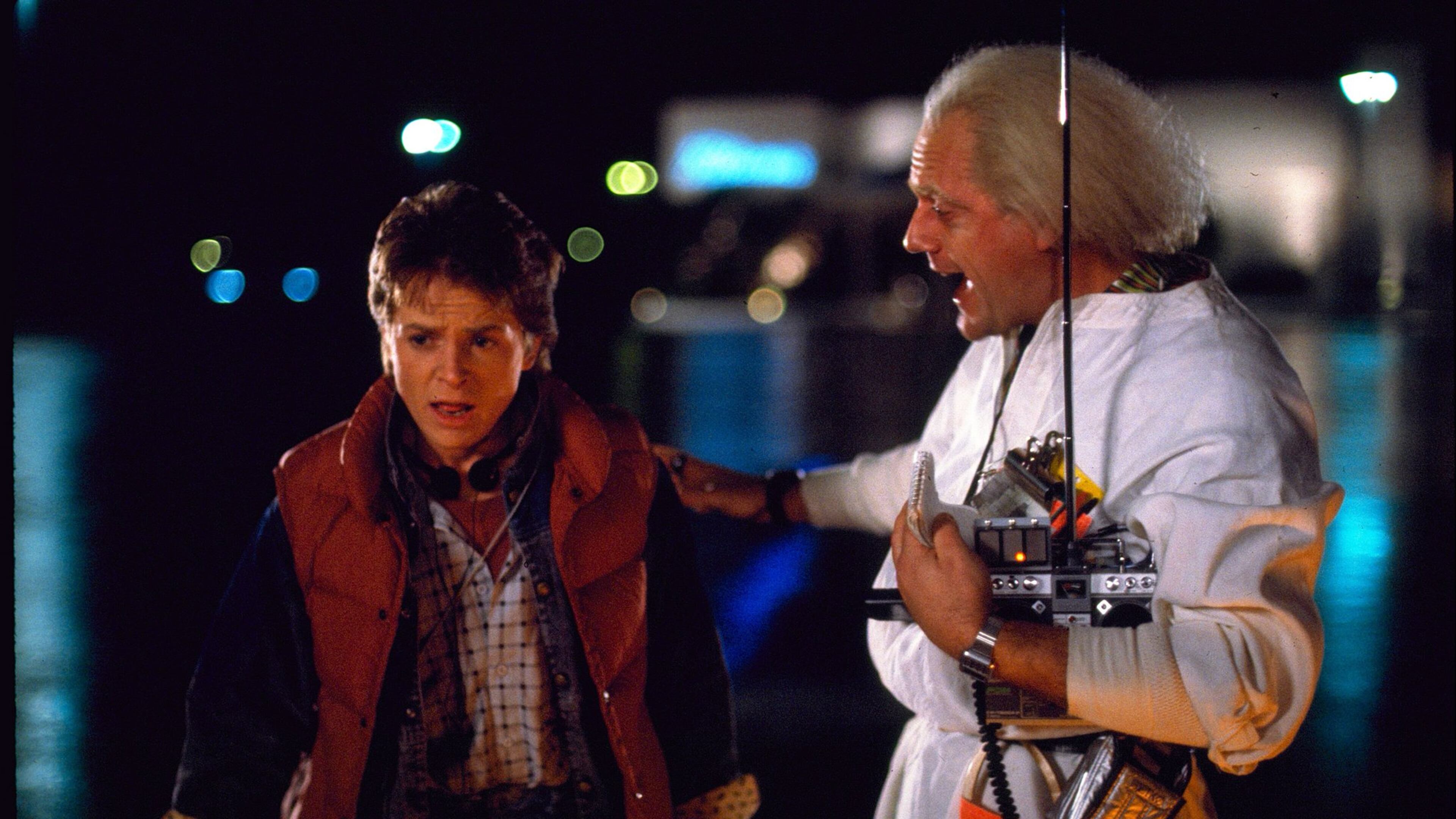 This photo released by Universal Pictures shows, Michael J. Fox, left, as Marty McFly, and Christopher Lloyd as Dr. Emmett Brown, in a scene from the 1985 film, “Back to the Future.” Co-stars Lea Thompson, Lloyd and others gather on Tuesday, June 30, 2015, for a special screening of the 1985 Michael J. Fox time-travel blockbuster, to be presented on the massive Hollywood Bowl screen with musical score performed live and orchestra conducted by the original composer, Alan Silvestri. (Universal Pictures via AP)