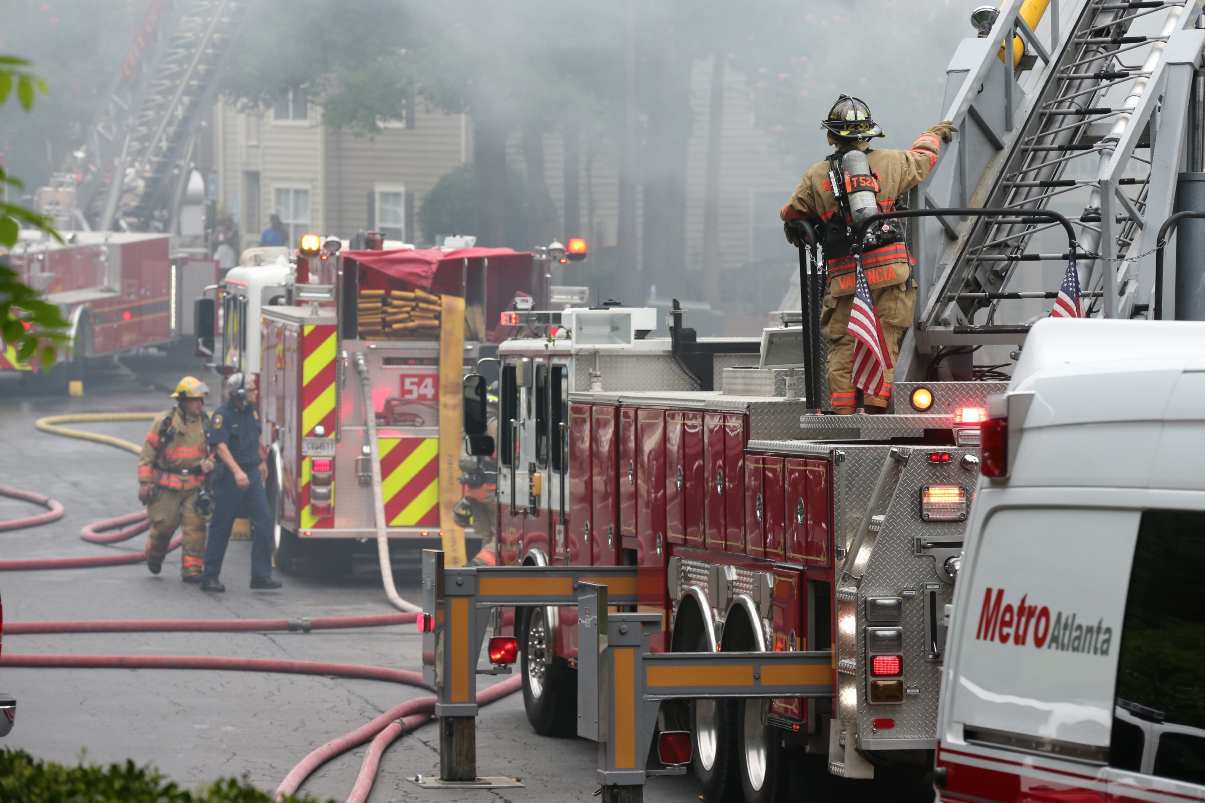 Cobb firefighters respond to a blaze at an apartment building on Powder Springs Road just south of Marietta on Friday, August 16, 2013.
