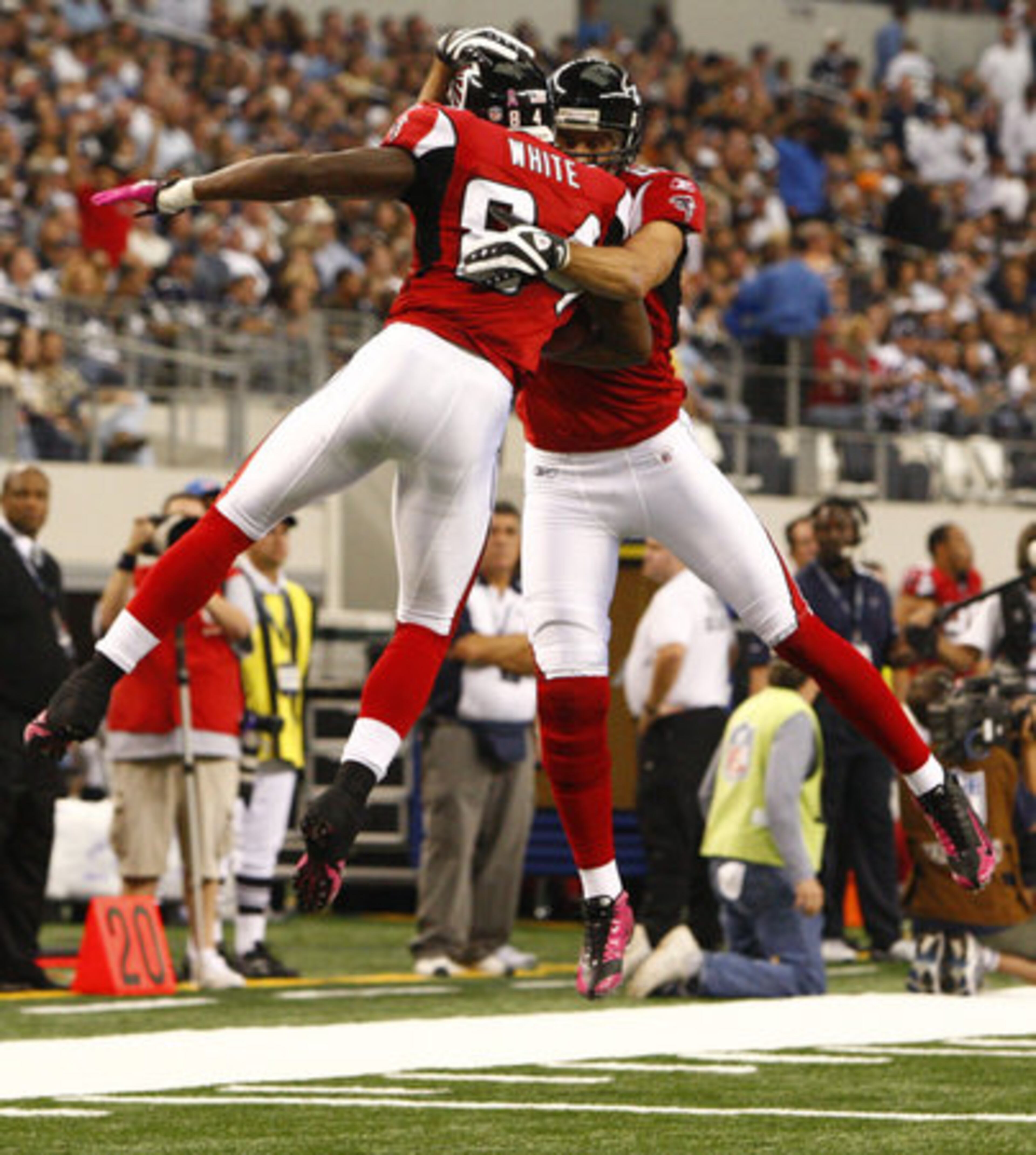 Falcons wide receiver Roddy White celebrates his 4-yard touchdown catch with Brian Finneran in the first half.