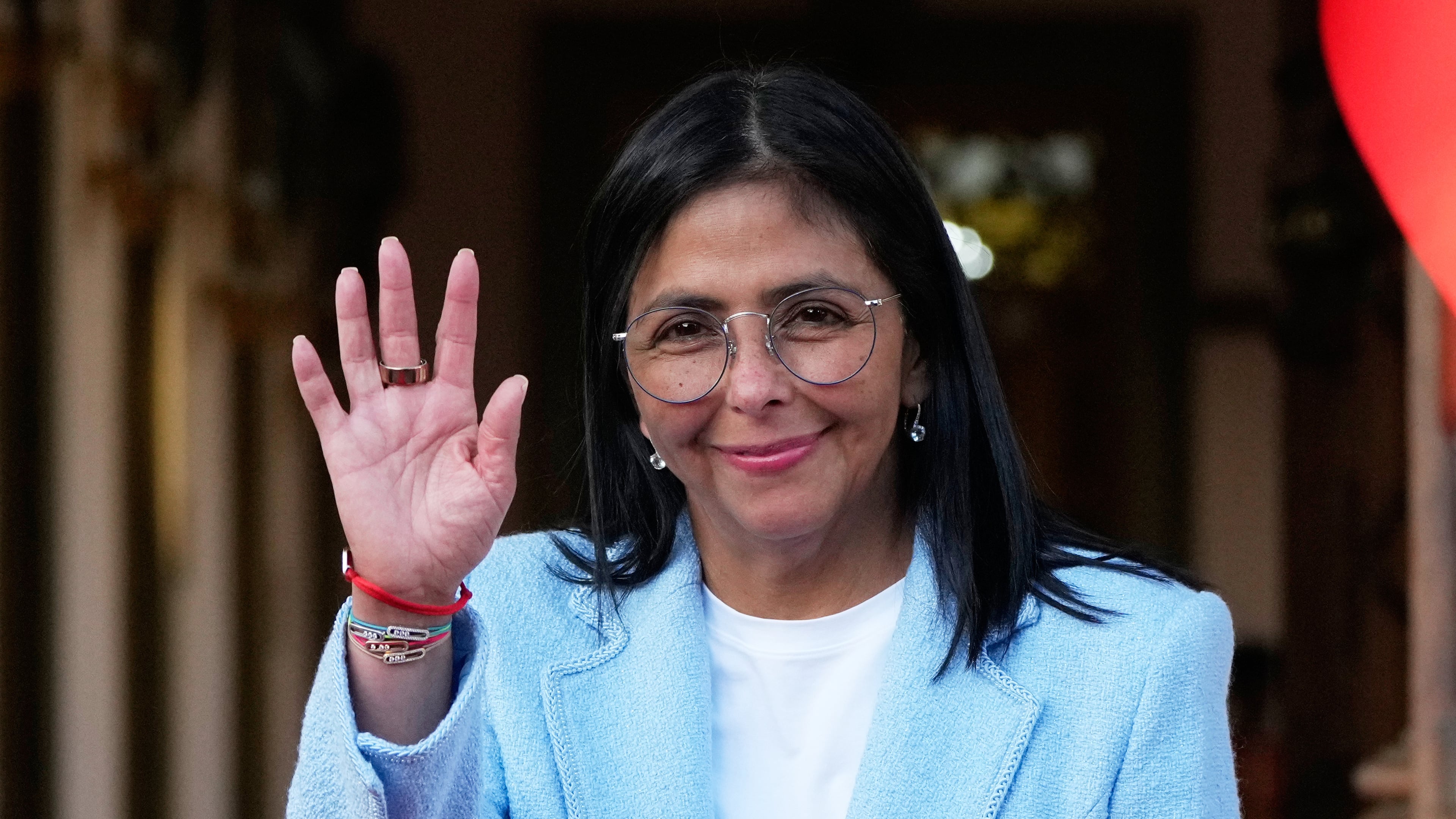 FILE - Venezuela's acting President Delcy Rodriguez waves after bidding farewell to U.S. Energy Secretary Chris Wright following their meeting at Miraflores Palace in Caracas, Venezuela, Feb. 11, 2026. (AP Photo/Ariana Cubillos, File)