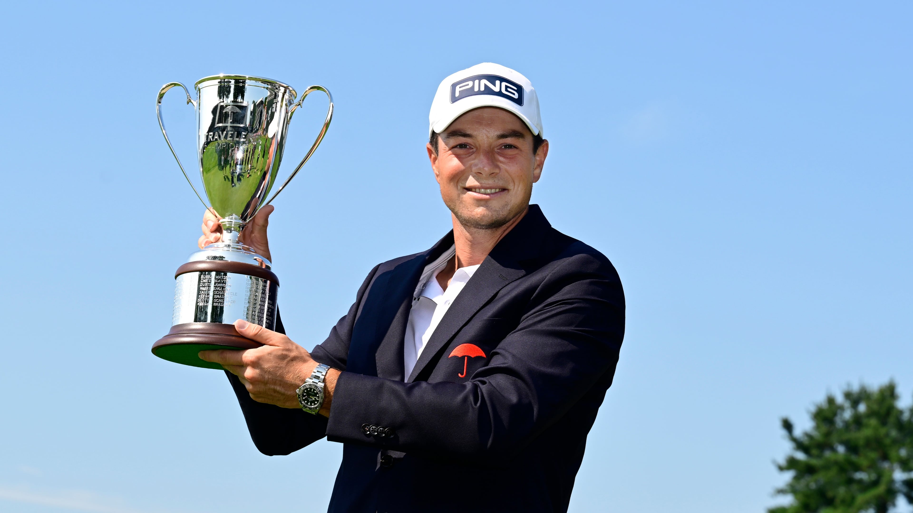 Viktor Hovland, of Norway, holds the Travelers Championship golf tournament trophy at TPC River Highlands, Monday, June 29, 2026, in Cromwell, Conn. (AP Photo/Jessica Hill)