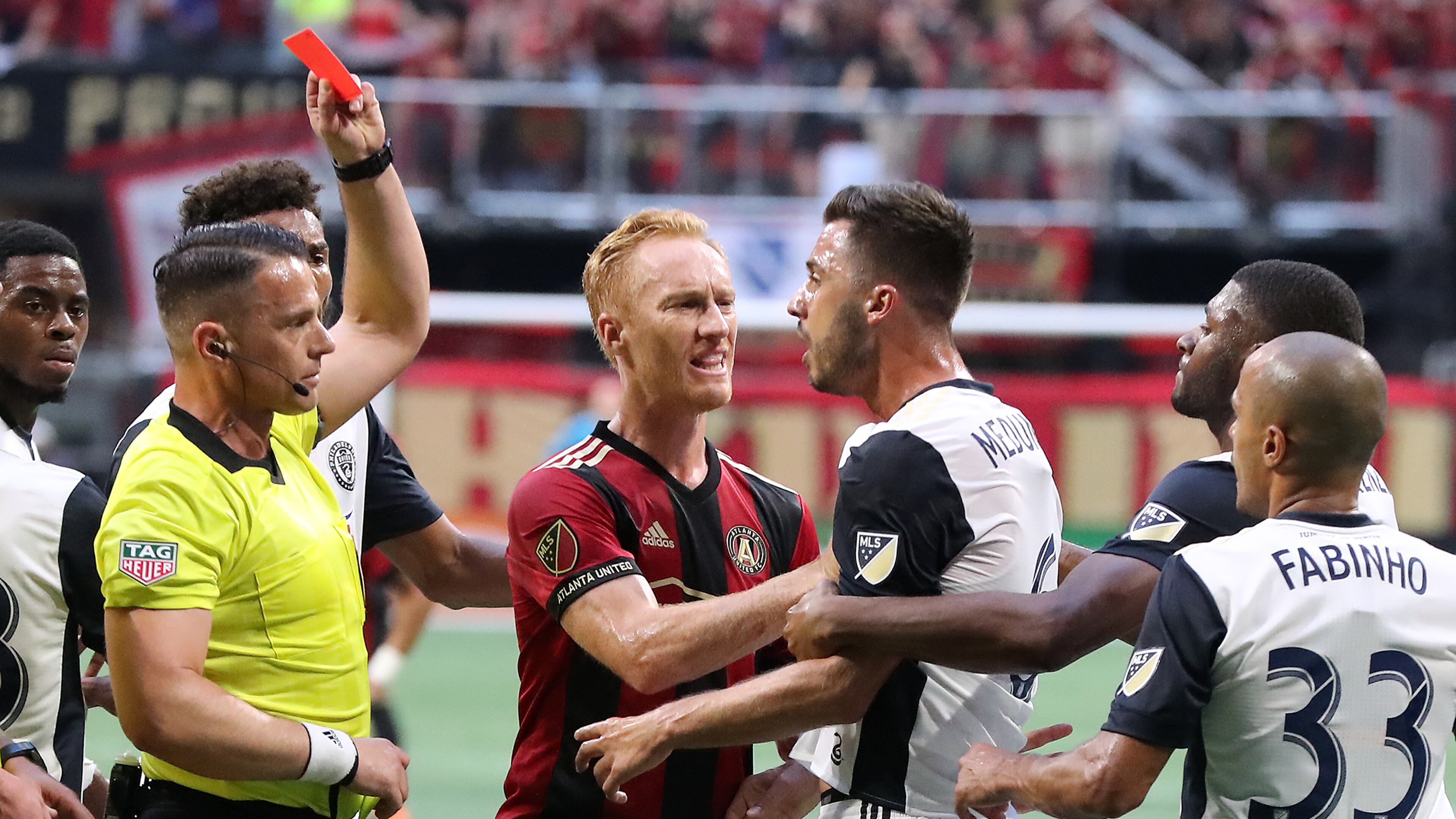 June 2, 2018 Atlanta: An official pulls a red card on Philadelphia Union midfielder Haris Medunjanin as Atlanta United midfielder Jeff Larentowicz holds him back while he argues a call during the first half in a MLS soccer match on Saturday, June 2, 2018, in Atlanta. Two Philadelphia Union players drew red cards on the play and were ejected from the game. Curtis Compton/ccompton@ajc.com