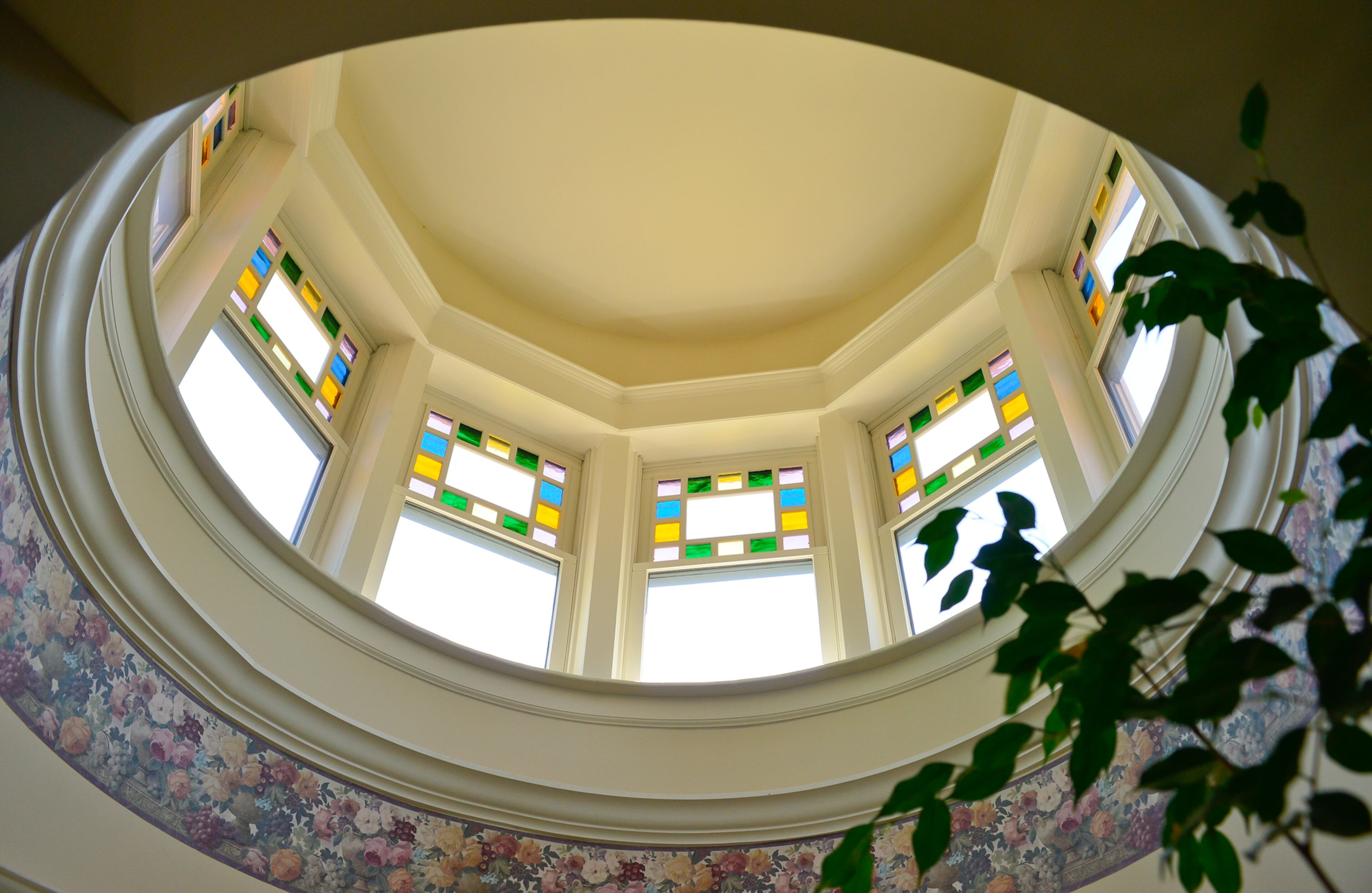Mike Dufano built the turret at his former home in Lawrenceville and builder Chris Cady's team assembled it on the Grant Park property. The stained glass was added after they moved into the home, which has a George F. Barber design from the 1890s.