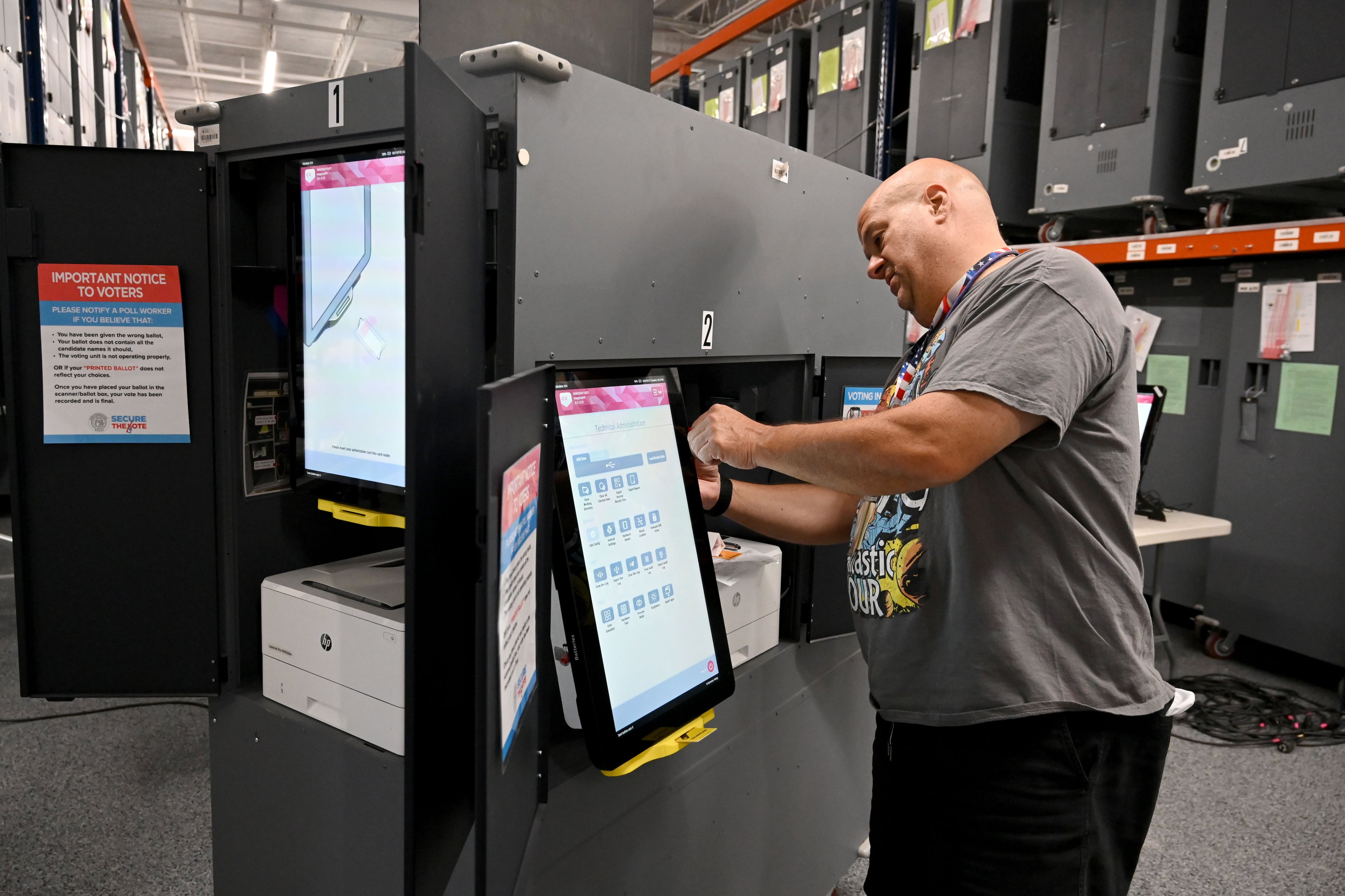 Craig Avena, an election worker, tests a voting touchscreen at the Cobb County Elections & Registration building in Marietta on Tuesday, Sept. 22, 2026. Officials are testing voting touchscreens, ballot scanners and check-in tablets in the run-up to the midterms in an effort to find and mitigate problems before voting starts. (Hyosub Shin/AJC)