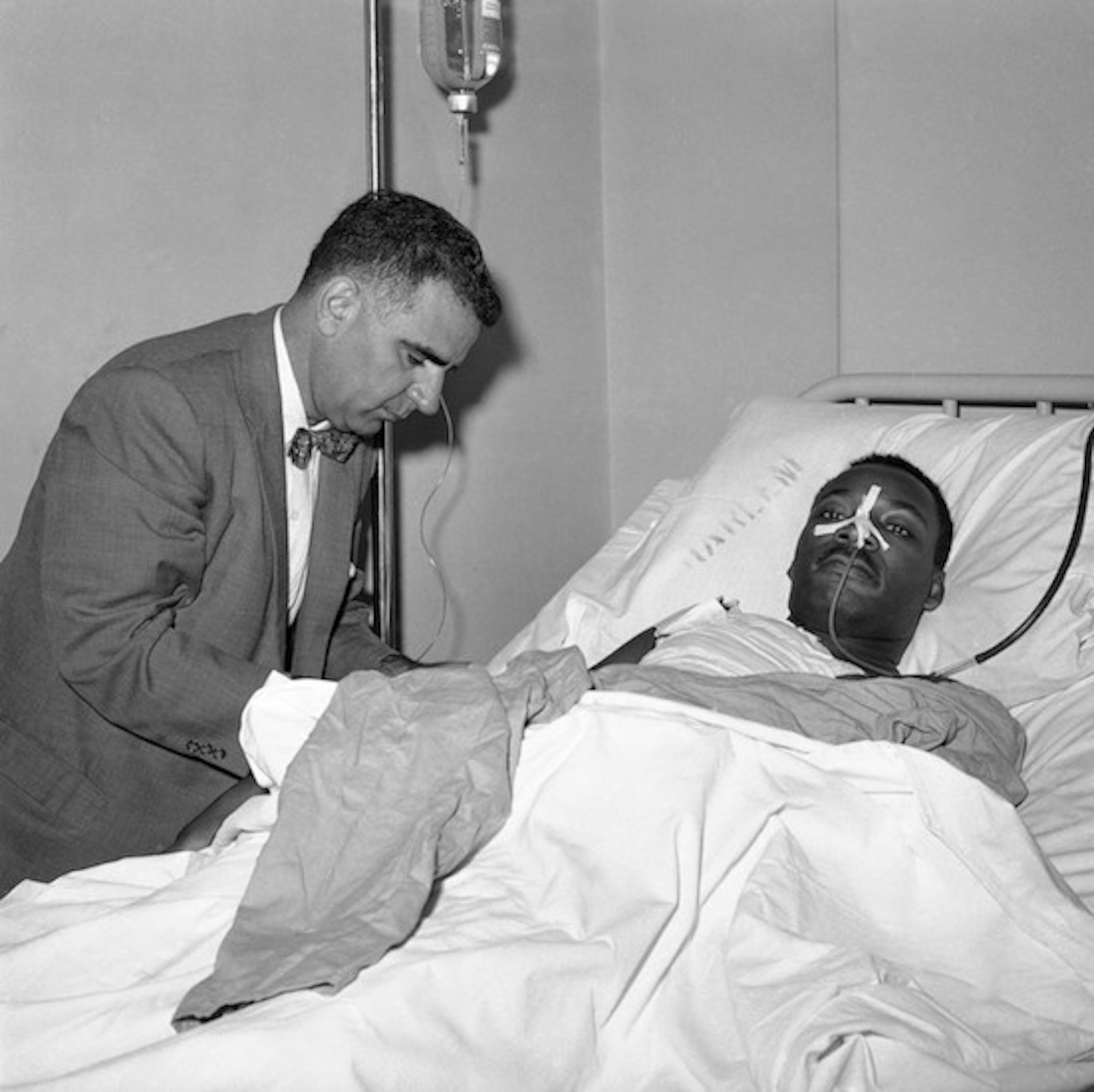 Dr. Emil A. Naclerio, member of the surgical team that operated on the Rev. Martin Luther King, at King’s bedside in Harlem Hospital in New York on Sept. 21, 1958. Rev. King, stabbed by Izola Ware Curry as he appeared at a Harlem Department store on September 20, was still on the critical list after an operation. (AP Photo/PL)