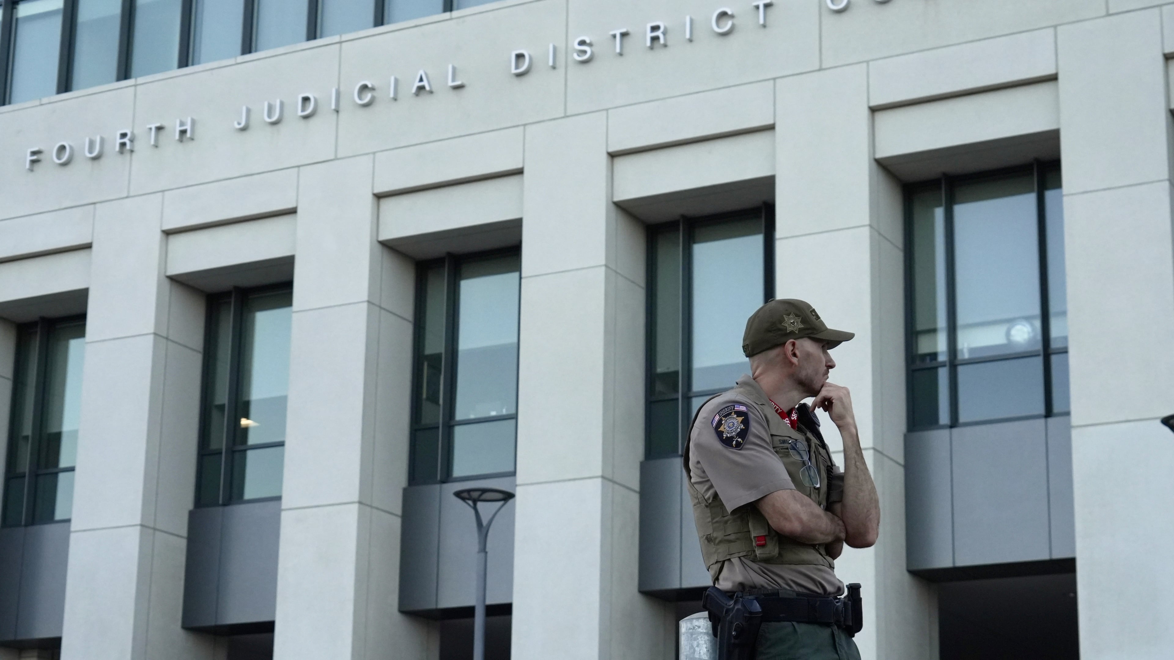 law enforcement monitors the parking lot outside the fourth judicial District courthouse where a preliminary hearing for Tyler Robinson, the Utah man accused of fatally shooting Charlie Kirk, in Provo, Utah, Friday, July 10, 2026. (AP Photo/Ty ONeil)