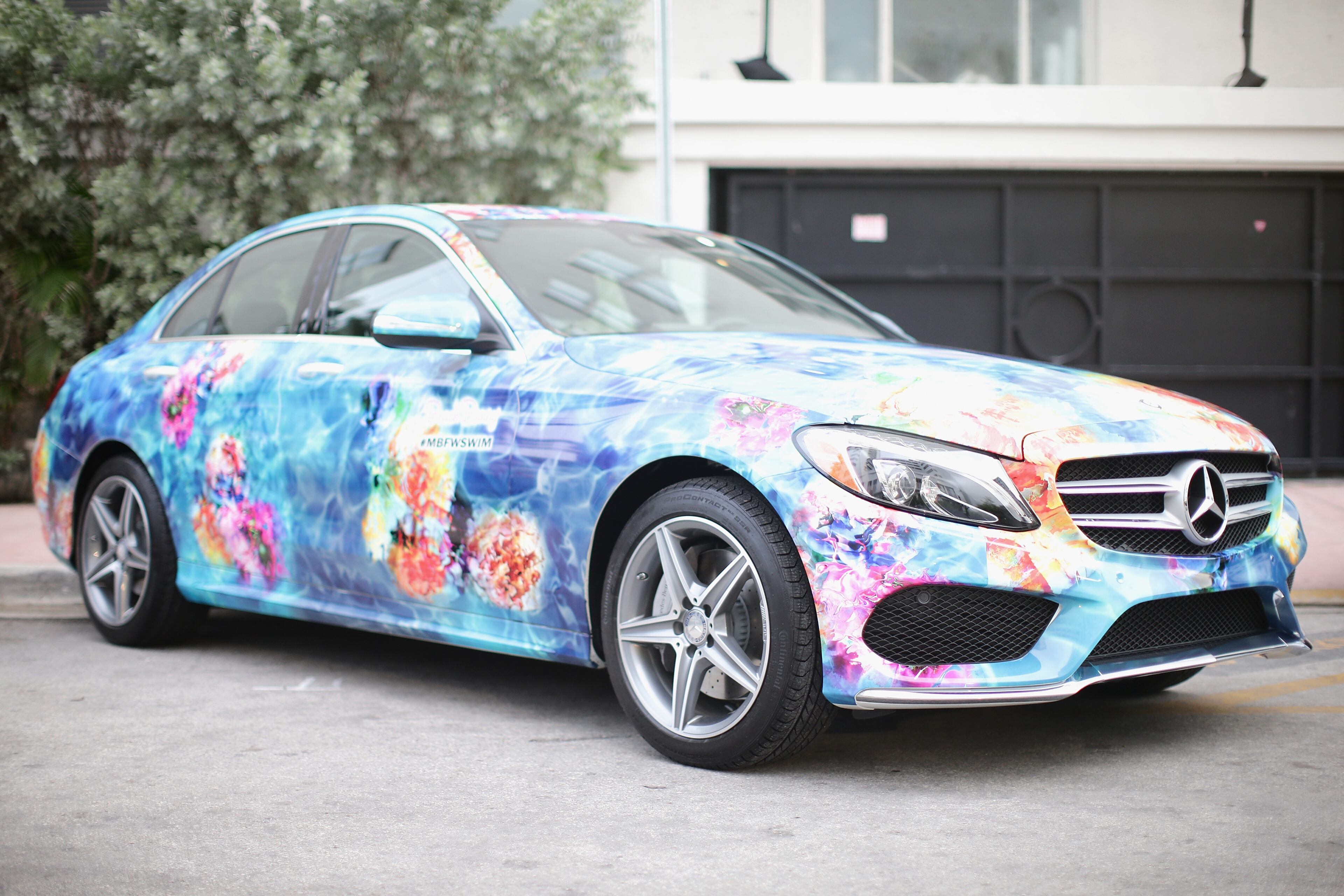 MIAMI BEACH, FL - JULY 17: A 2015 Mercedes-Benz C-Class featuring an exclusive design by Beach Bunny on display during Mercedes-Benz Fashion Week Swim 2015 at The Raleigh on July 17, 2014 in Miami Beach, Florida. (Photo by Neilson Barnard/Getty Images for Mercedes-Benz Fashion Week )
