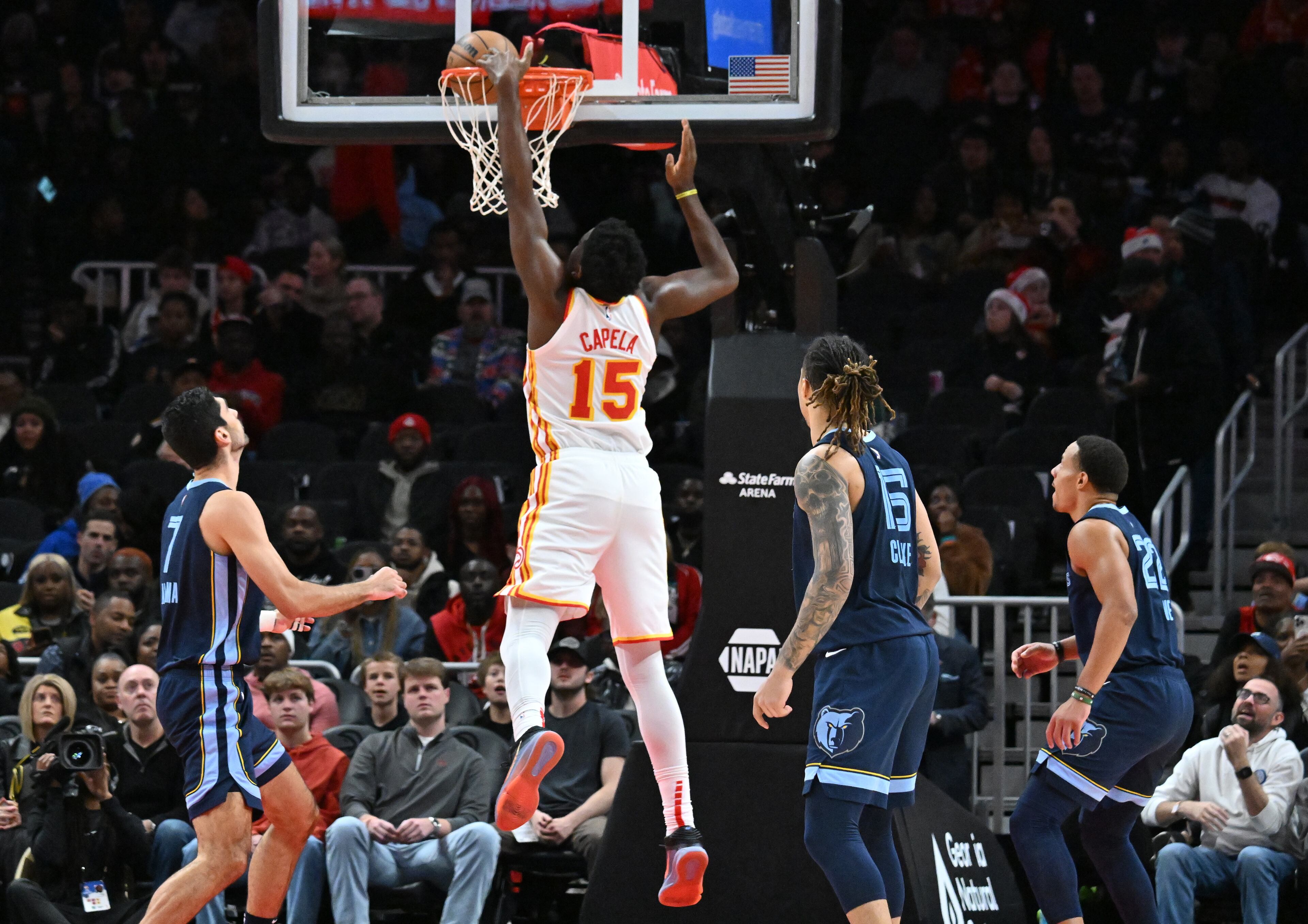 Atlanta Hawks center Clint Capela (15) dunks against the Memphis Grizzlies during the first half in an NBA basketball game at State Farm Arena, Saturday, December 21, 2024, in Atlanta. (Hyosub Shin / AJC)