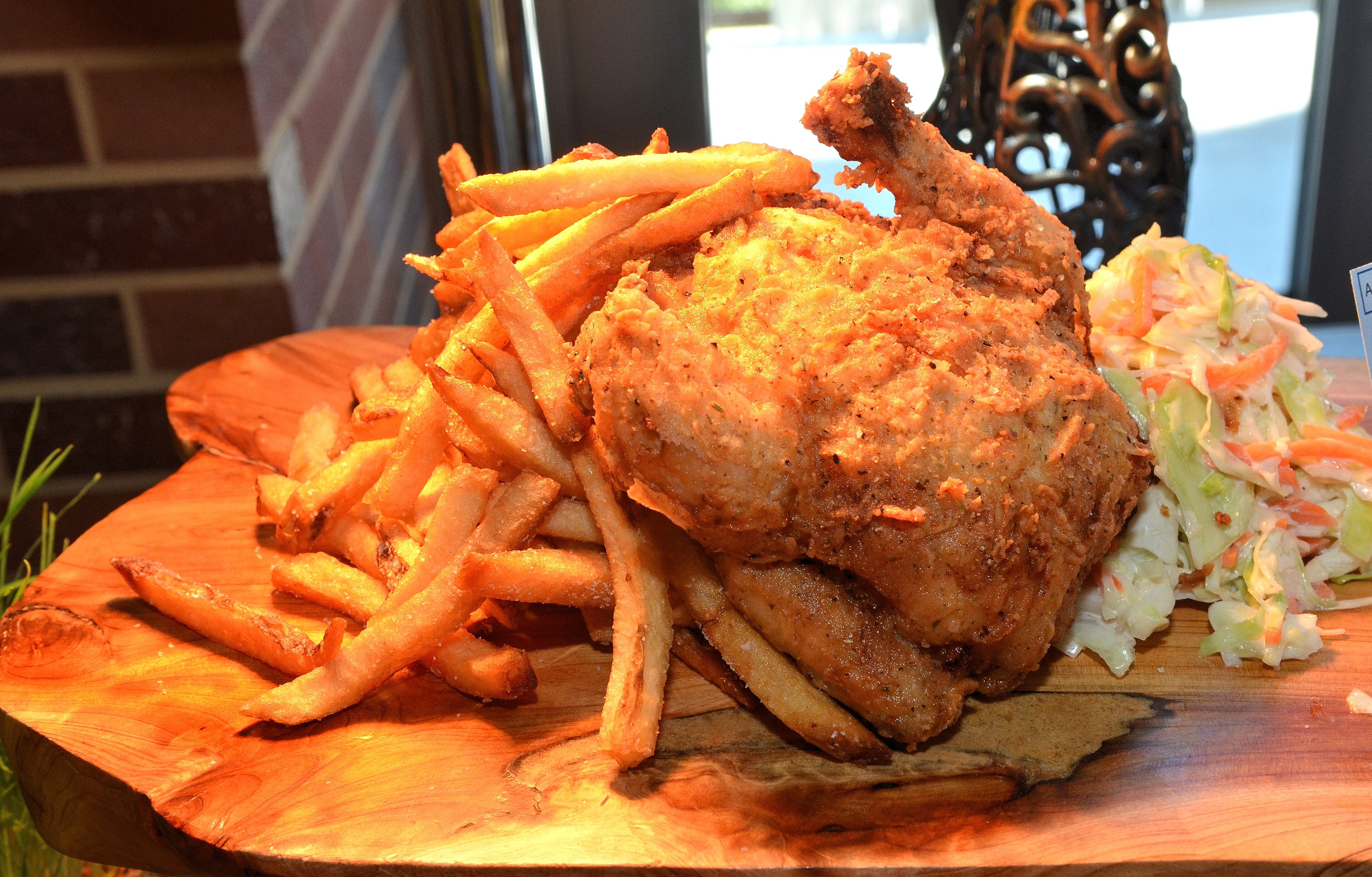 Hey Batter Batter Bird (Section 138). A whole buttermilk brined chicken, seasoned with our special blend and southern fried, set atop a mound of fresh hand cut French fries with creamy coleslaw. $18.00