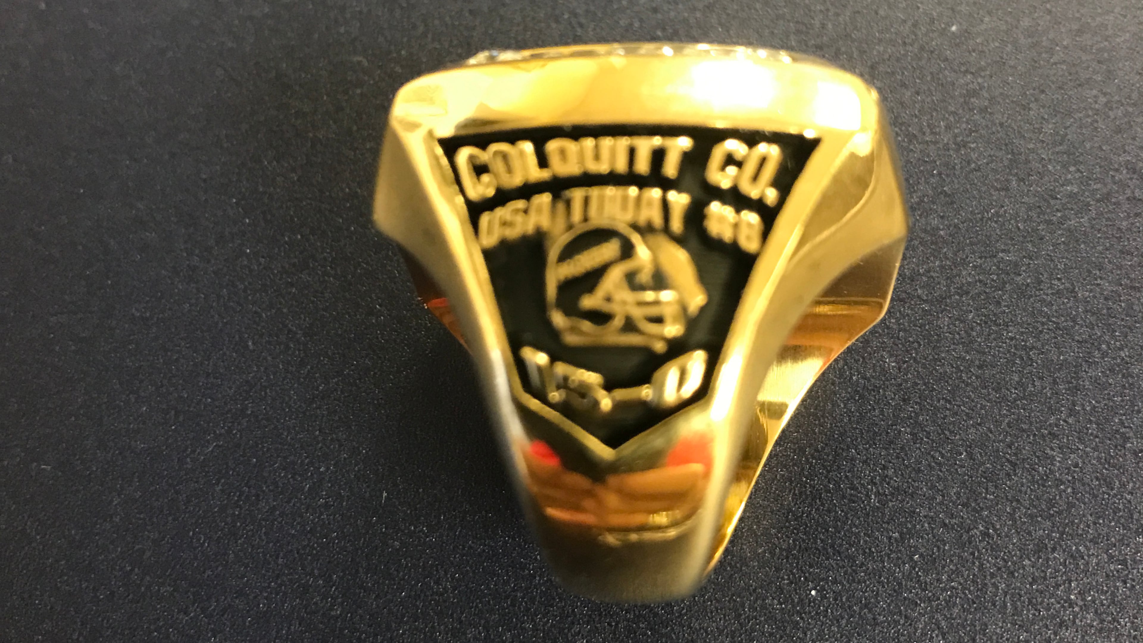 A side view of Moultrie, Ga., Colquitt County's 2015 championship ring, noting their 15-0 finish and highest USA Today ranking.