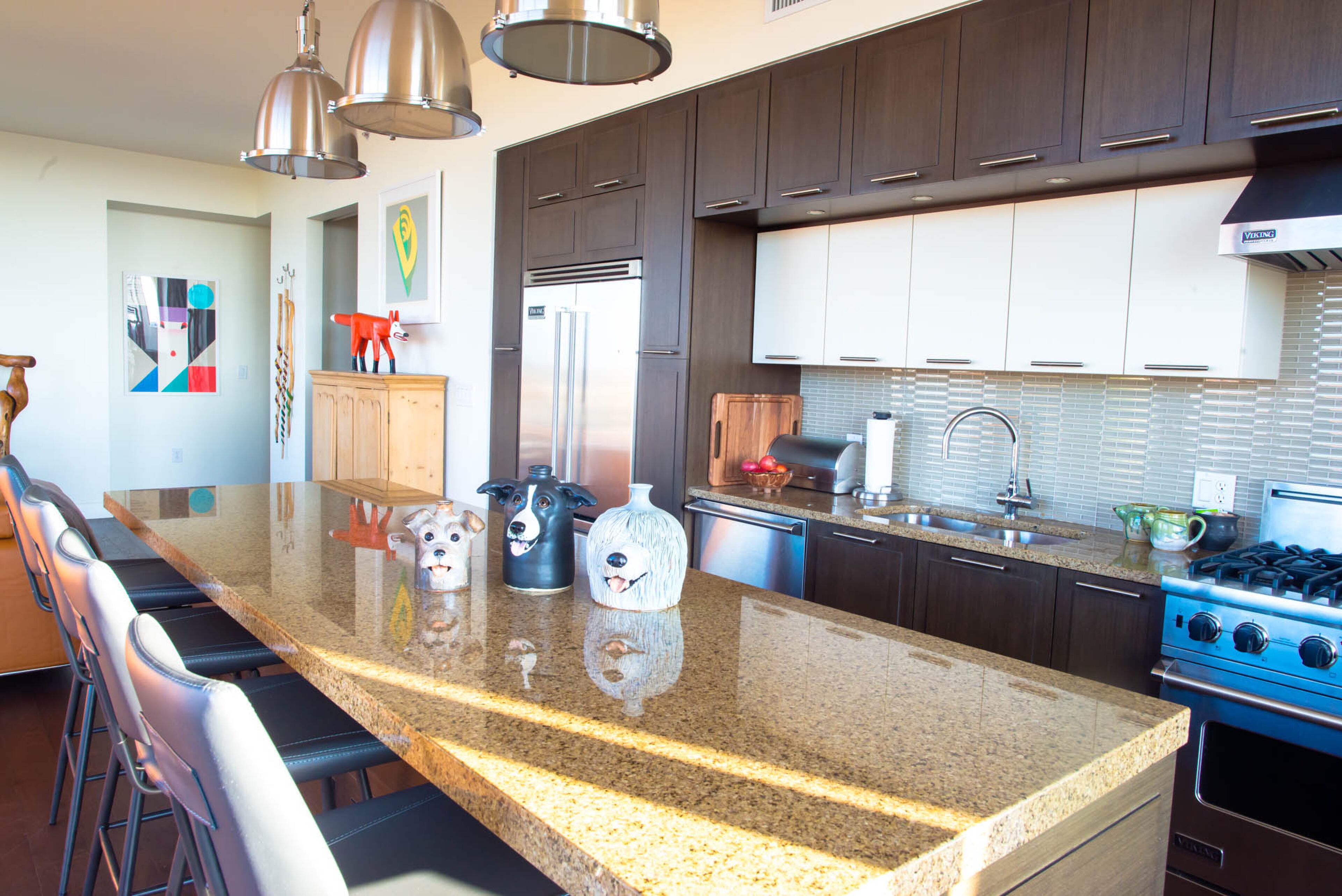 Homeowner and artist Pippa Seichrist's latest work includes crafting these adorable dog jugs. Her favorite is the Old English sheepdog (right). "When anybody sees it they just start smiling and laughing," she said. Her collection will soon be sold at her favorite folk art gallery, Main Street Gallery in Clayton. Text by Anna Logan/Fast Copy News Service.