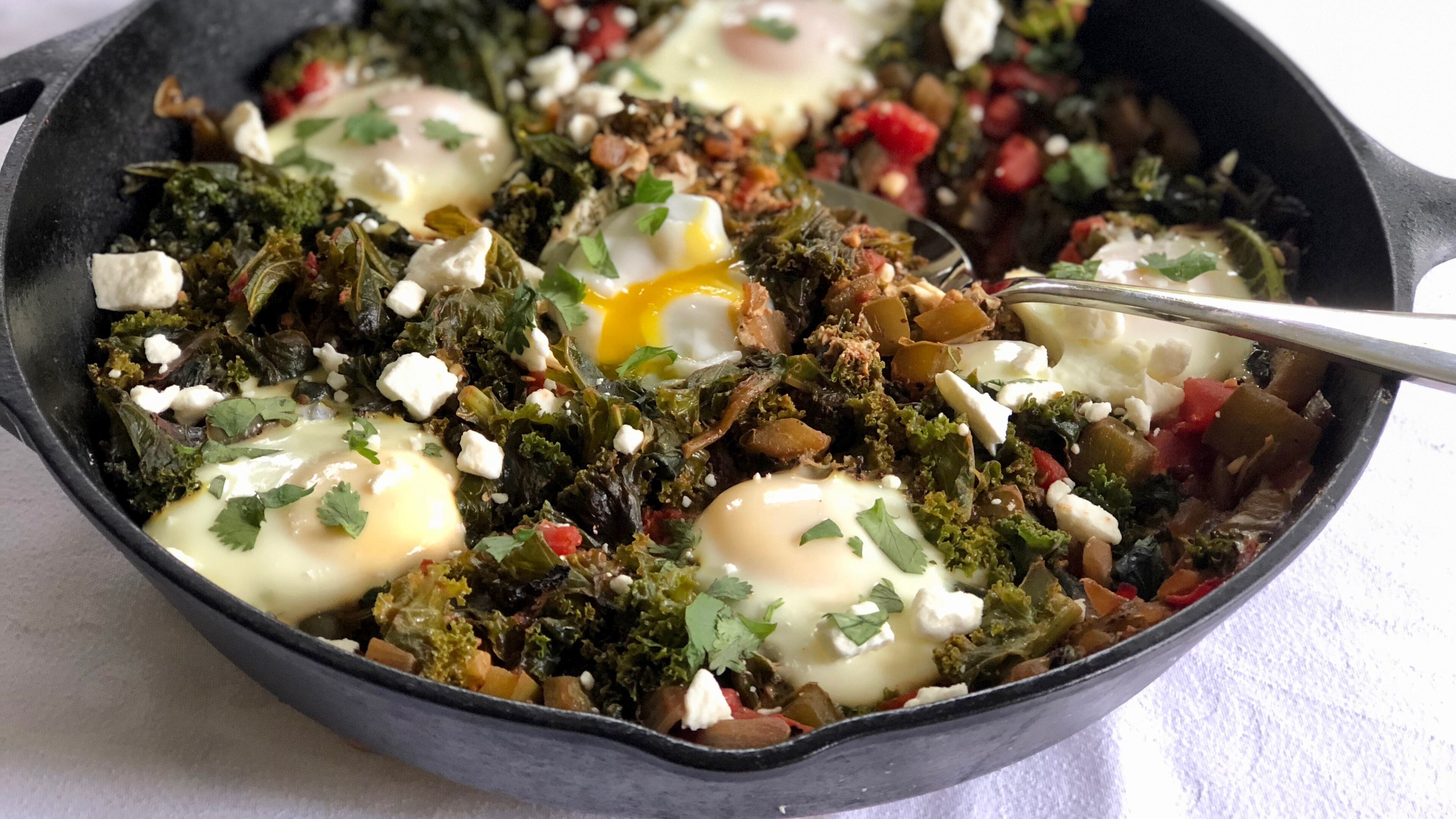 Re-think comfort food by filling your skillet with greens and eggs. PHOTO CREDIT: Kellie Hynes