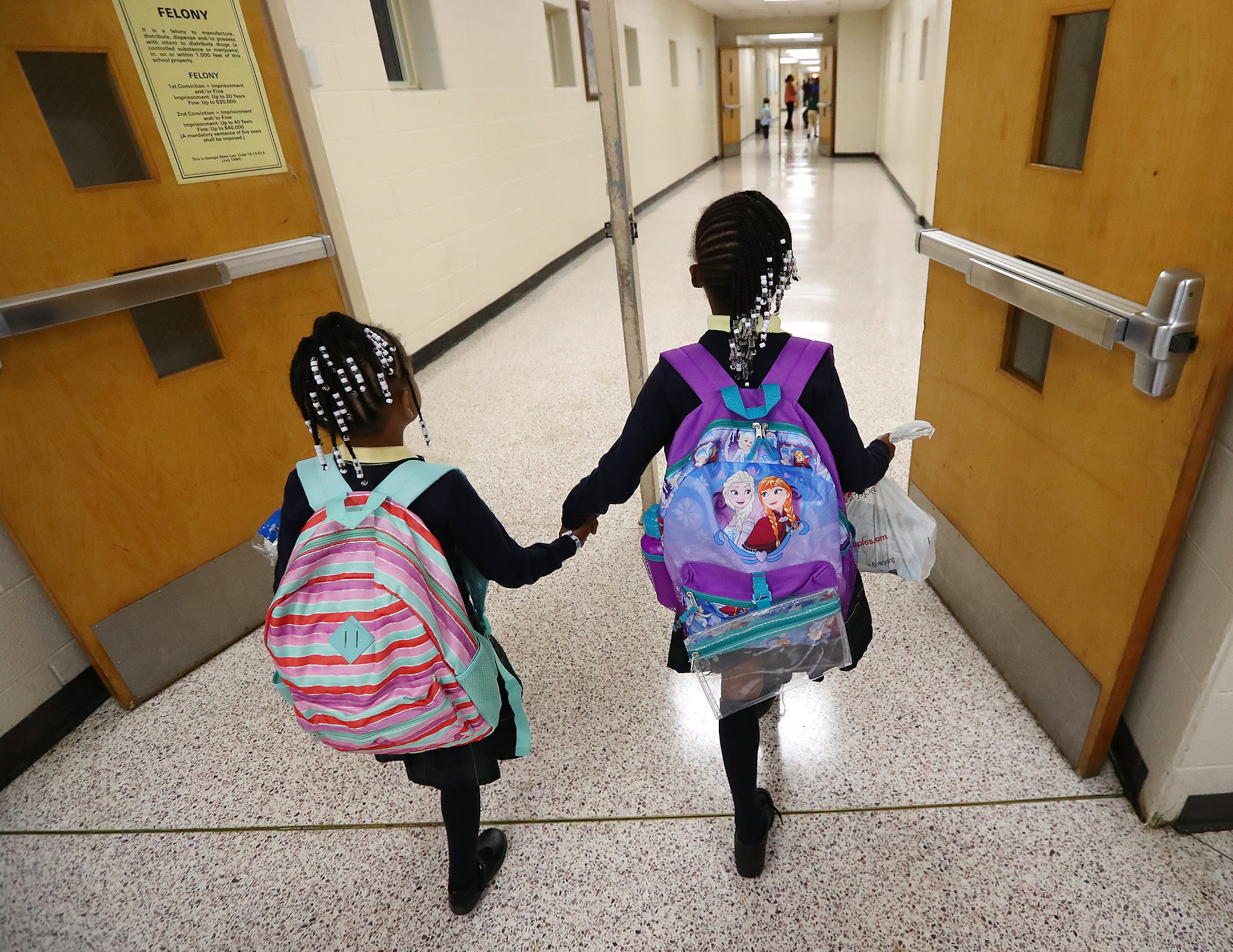 August 7, 2017 Lithonia; Fifth grade student Isaiah Brown, 10, enjoys the freedom of an open hallway as he is the first student to arrive for the first day of school at Edward L Bouie Elementary School on Monday, August 7, 2017, in Lithonia. Curtis Compton/ccompton@ajc.com