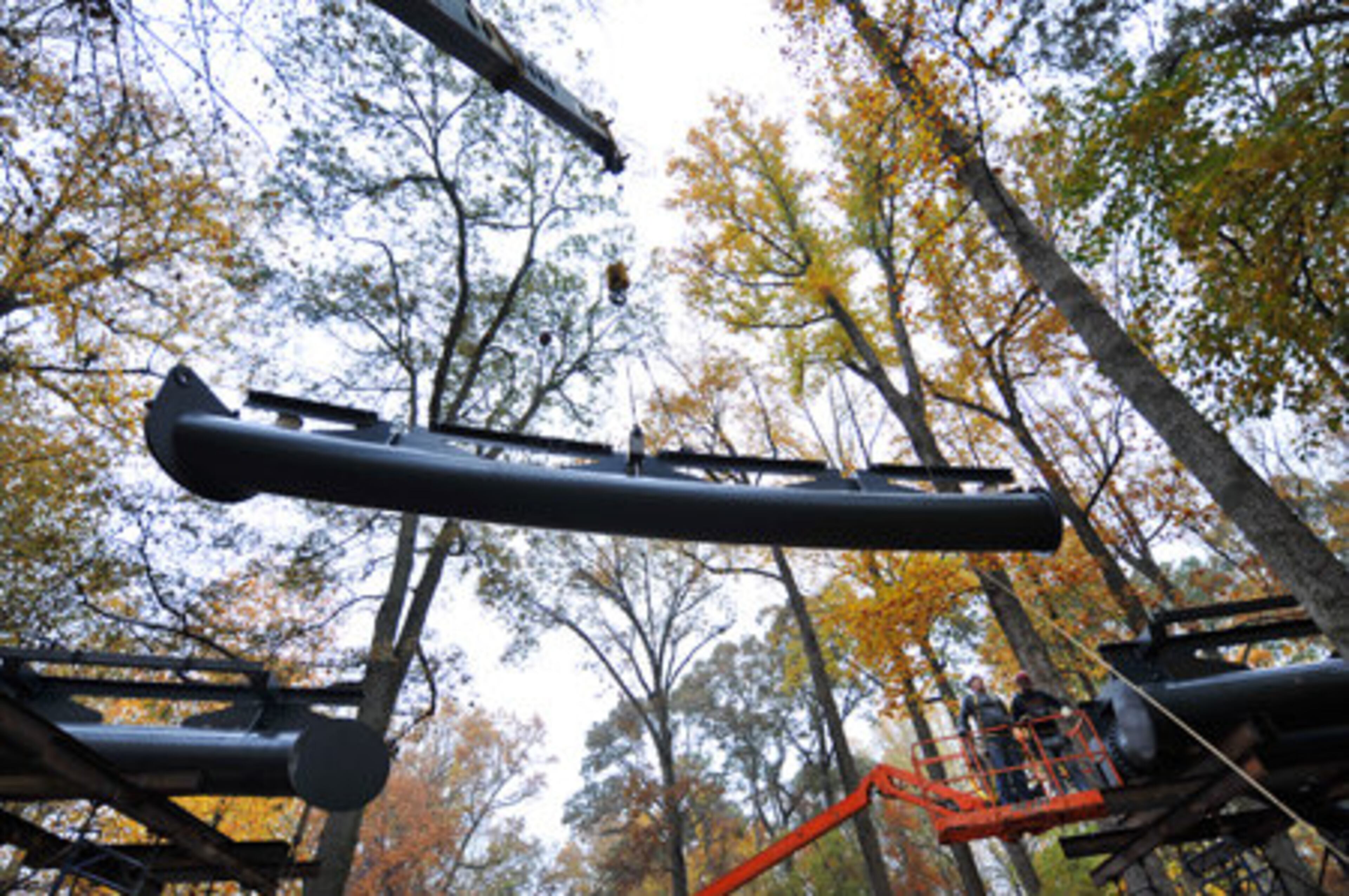 Construction of the walkway was well under way and was scheduled to open in a few months. Here, crews install the final section of a 600-foot-long, 45-foot-tall skywalk in mid-November. It is part of the garden's $50 million expansion.