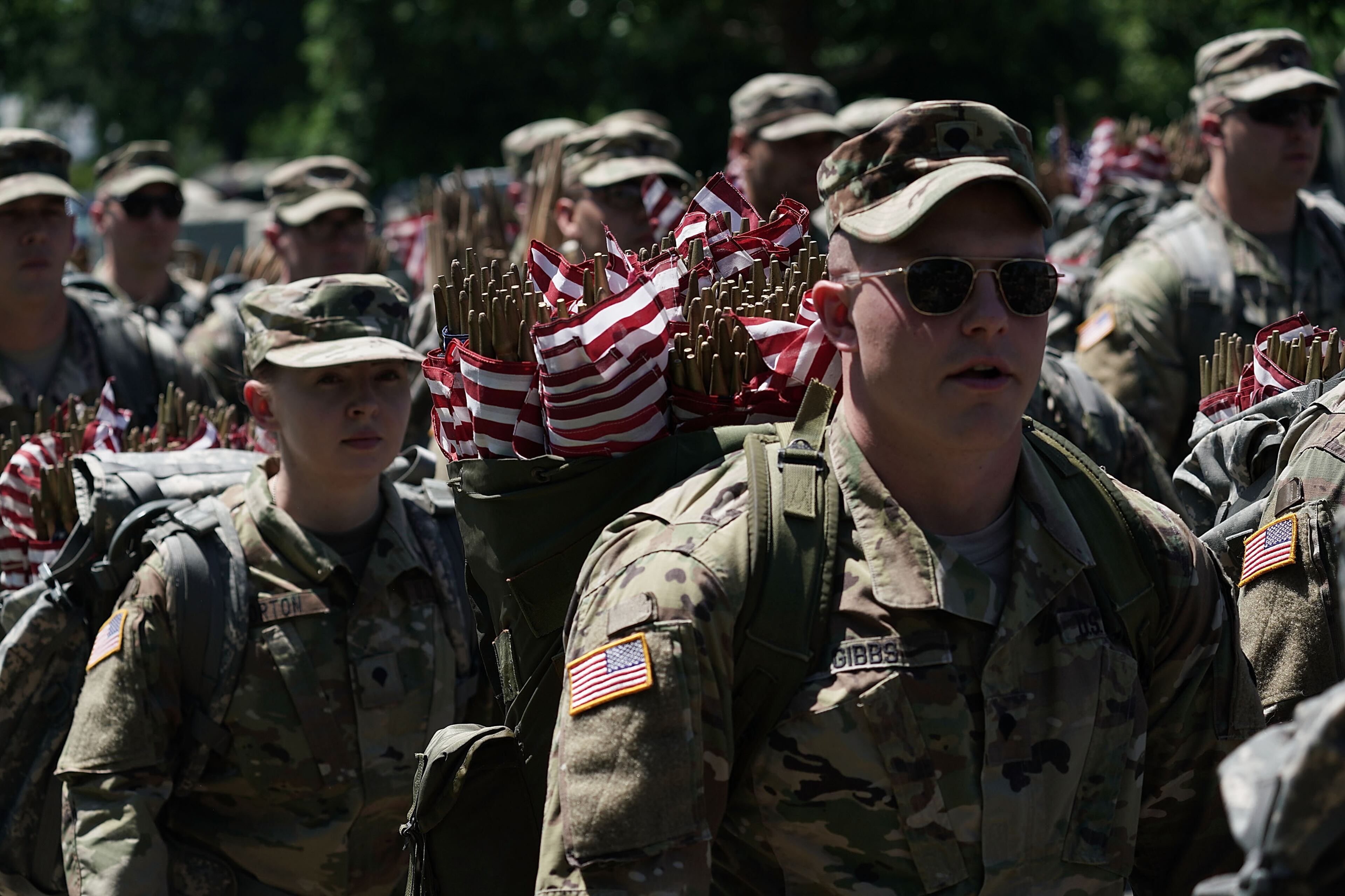 ARLINGTON, VA - MAY 24: Soldiers with the U.S. Army 3rd Infantry Regiment (The Old Guard) participate in a "Flags In" event May 24, 2018 at Arlington National Cemetery in Arlington, Virginia. The cemetery hosts the annual event to adorn all cemetery graves with U.S. flags in advance of Memorial Day. (Photo by Alex Wong/Getty Images)