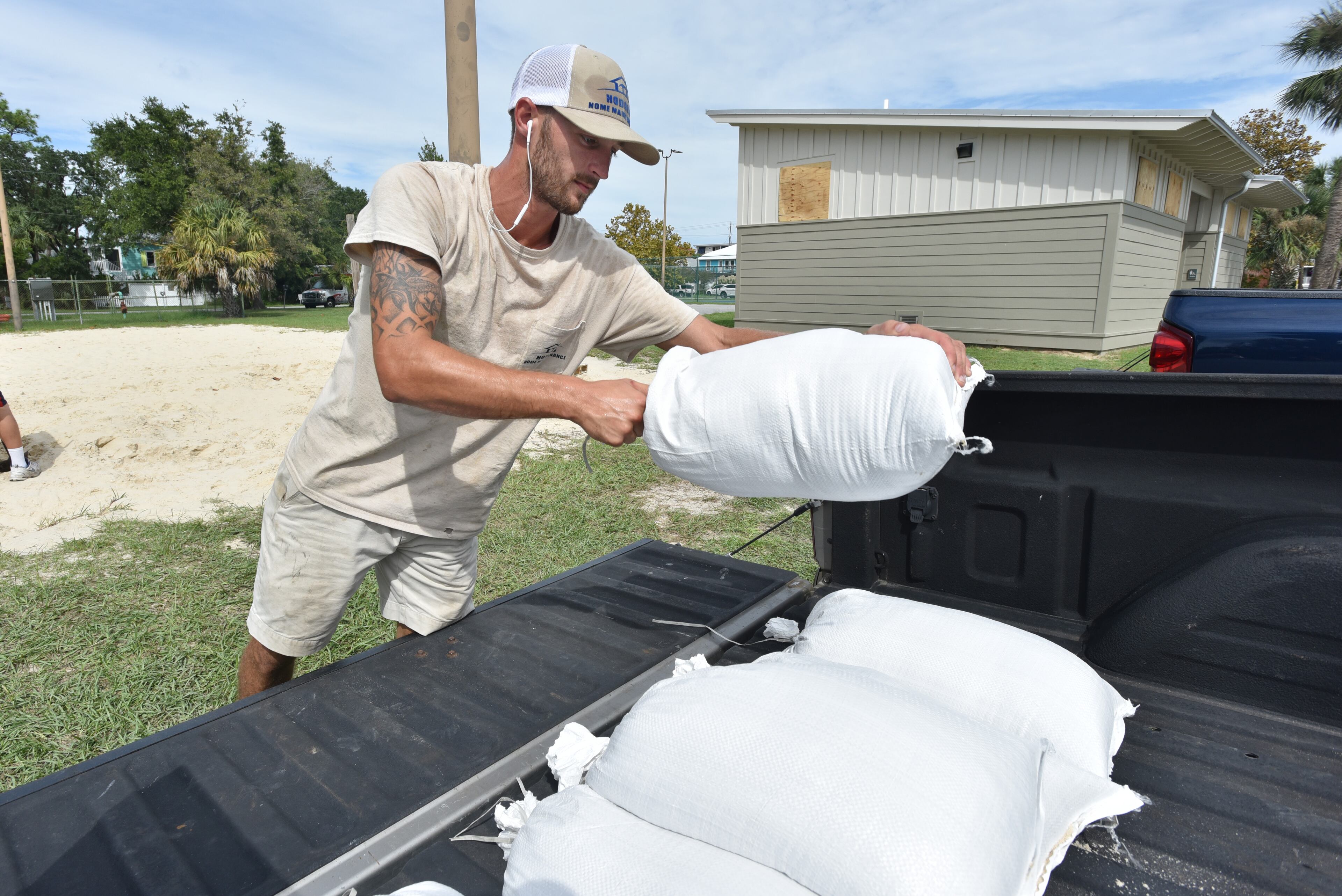 September 13, 2018 Tybee Island - David Attia, of Tybee Island, fills sandbags with sand provided by the City of Tybee Island ahead of Hurricane Florence on Thursday, September 13, 2018. Heavy rain bands with tropical storm-force winds are spreading across the outer banks of North Carolina as the eye of Hurricane Florence, now a Category 2 storm, approaches the United States. HYOSUB SHIN / HSHIN@AJC.COM