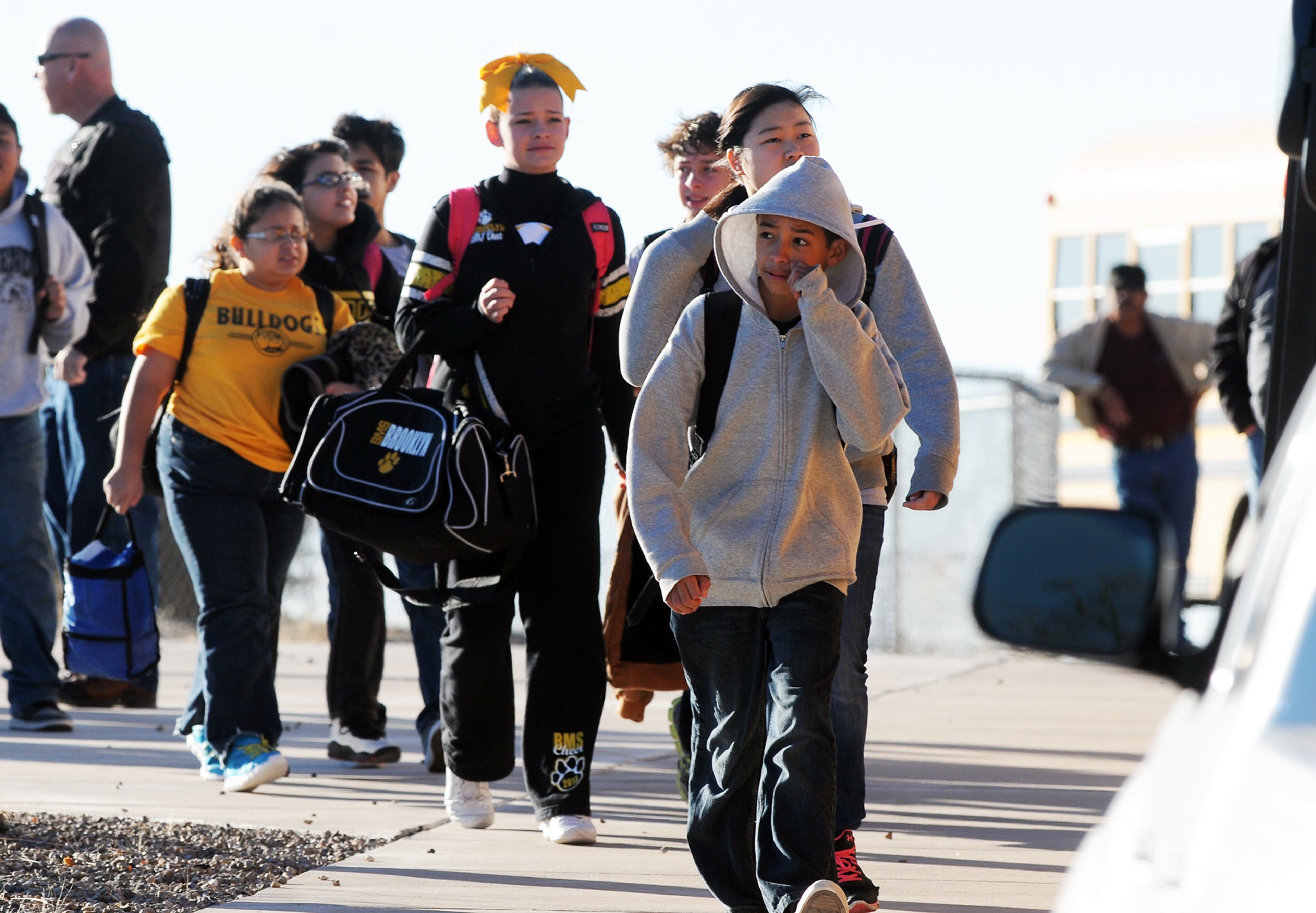 Students are escorted from Berrendo Middle School after a shooting on Jan. 14, 2014, in Roswell, N.M.