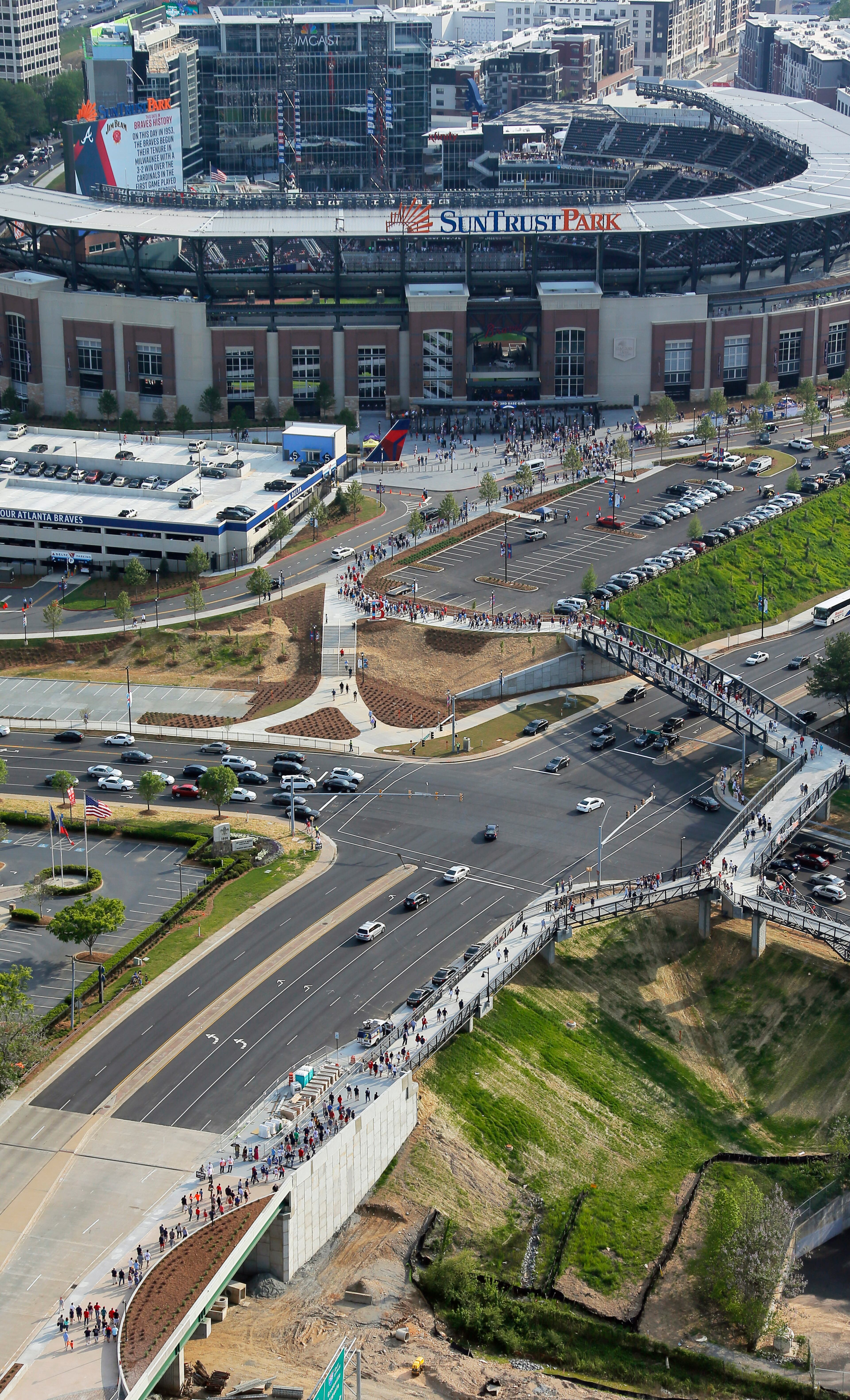 Fans enter SunTrust Park about an hour before game time. This view is looking west toward the park.