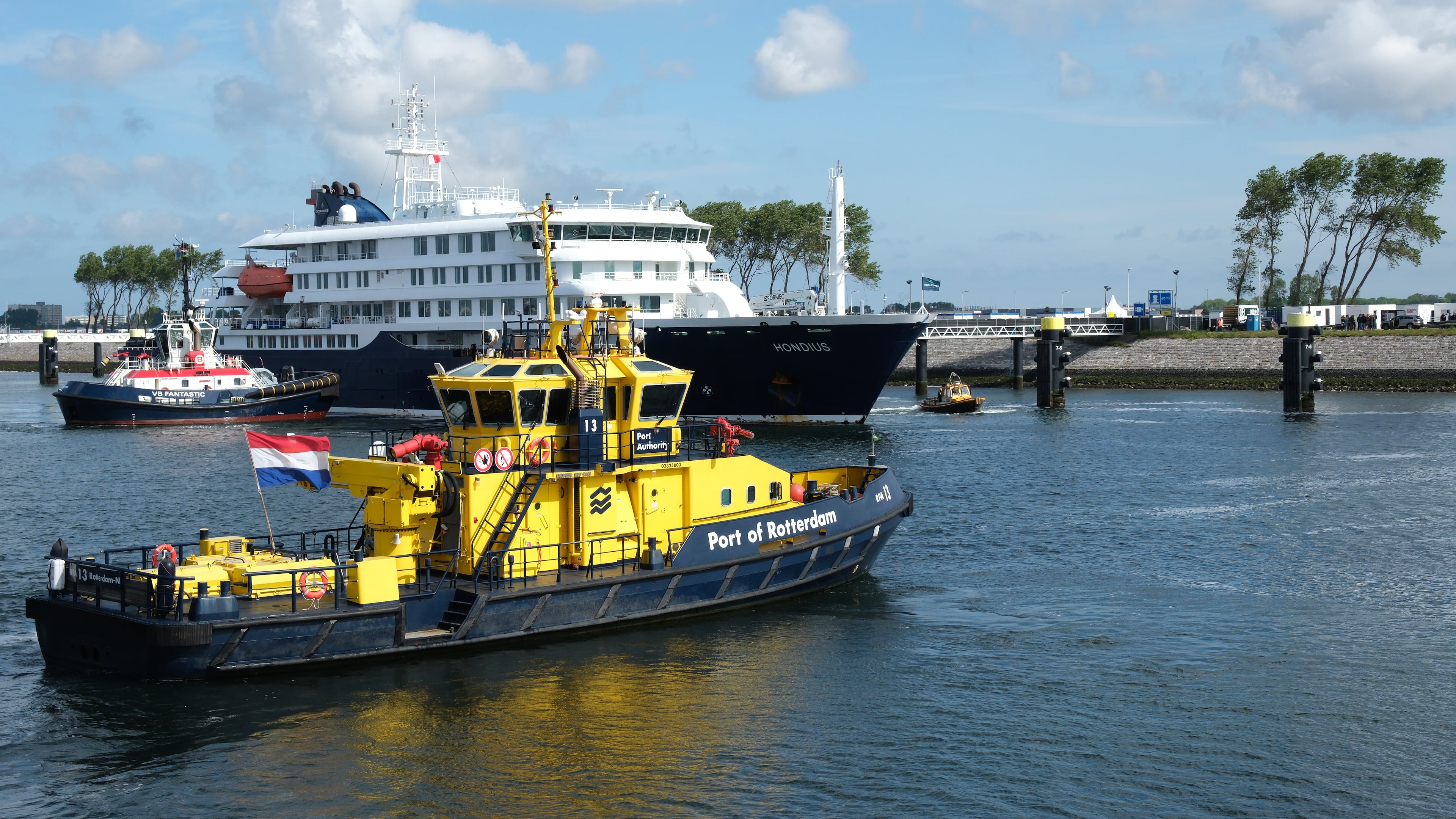 The MV Hondius cruise ship, center, arrives at the Port of Rotterdam, Netherlands, Monday, May 18, 2026. (AP Photo/Patrick Post)