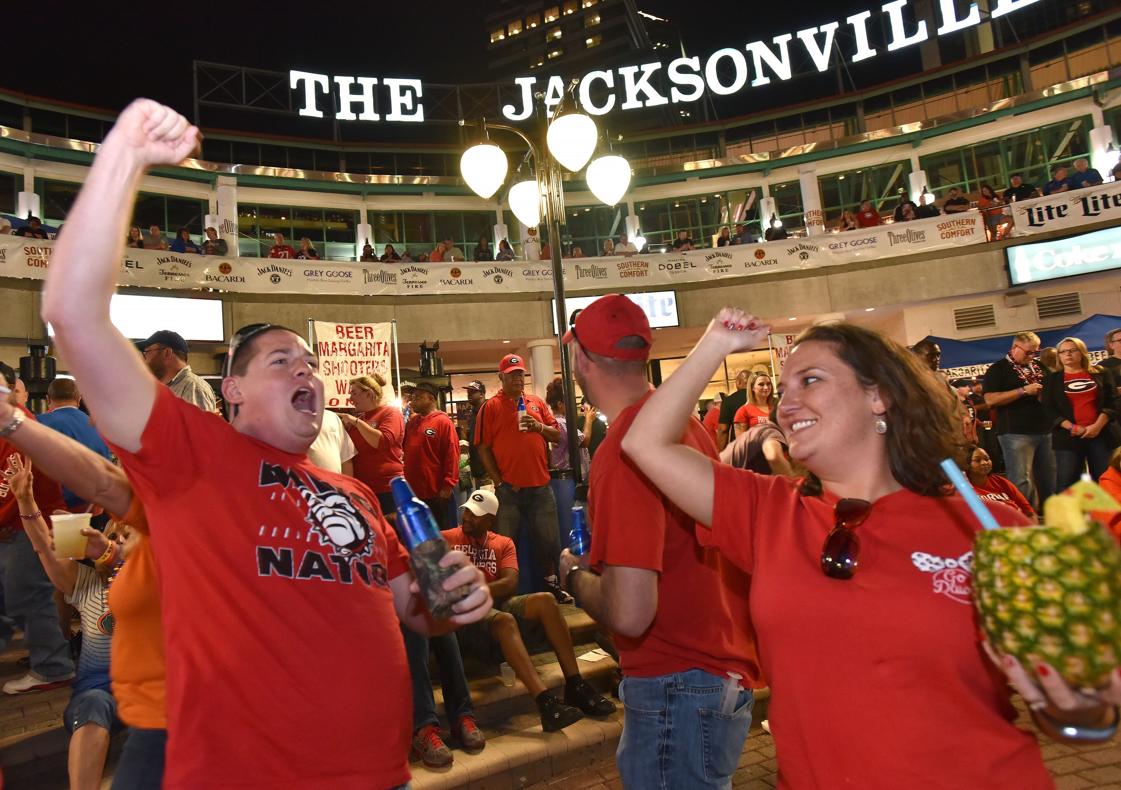 October 30, 2015 Jacksonville, Florida - Georgia and Florida fans gather to celebrate during an annual party at the Jacksonville Landing on the eve of the Georgia - Florida game on Friday, October 30, 2015. HYOSUB SHIN / HSHIN@AJC.COM