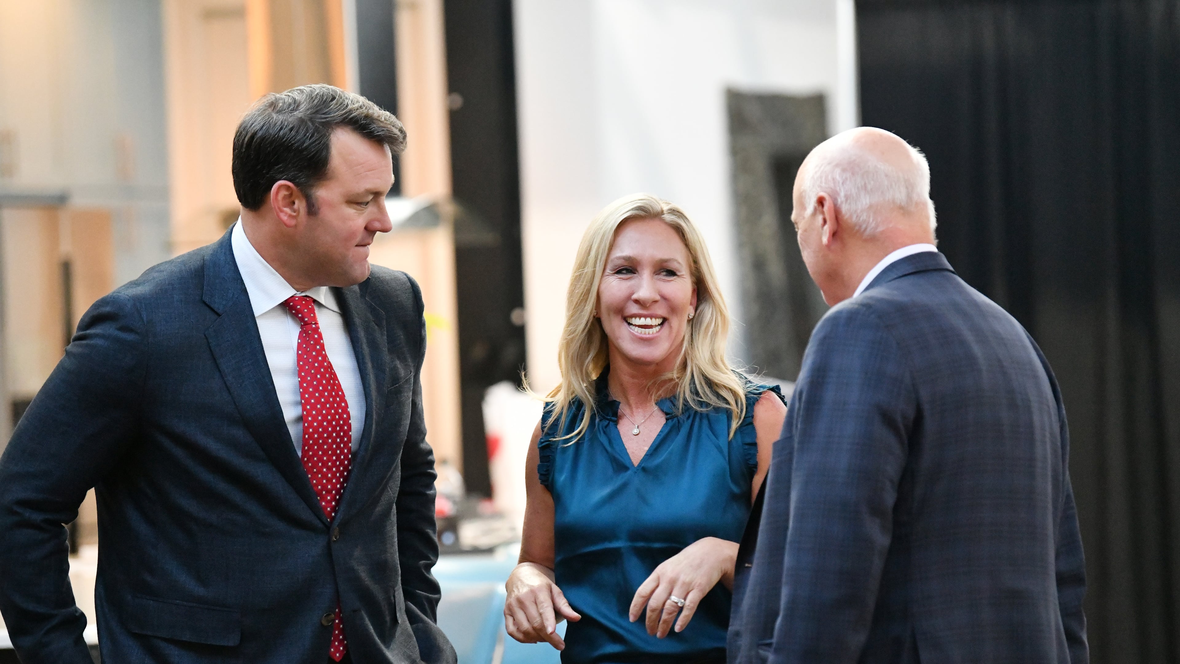 U.S. Rep. Marjorie Taylor Greene speaks with state Sens. Burt Jones (left) and Brandon Beach during a "2020 Election Integrity Townhall" meeting Tuesday in Rome. (Hyosub Shin / Hyosub.Shin@ajc.com)