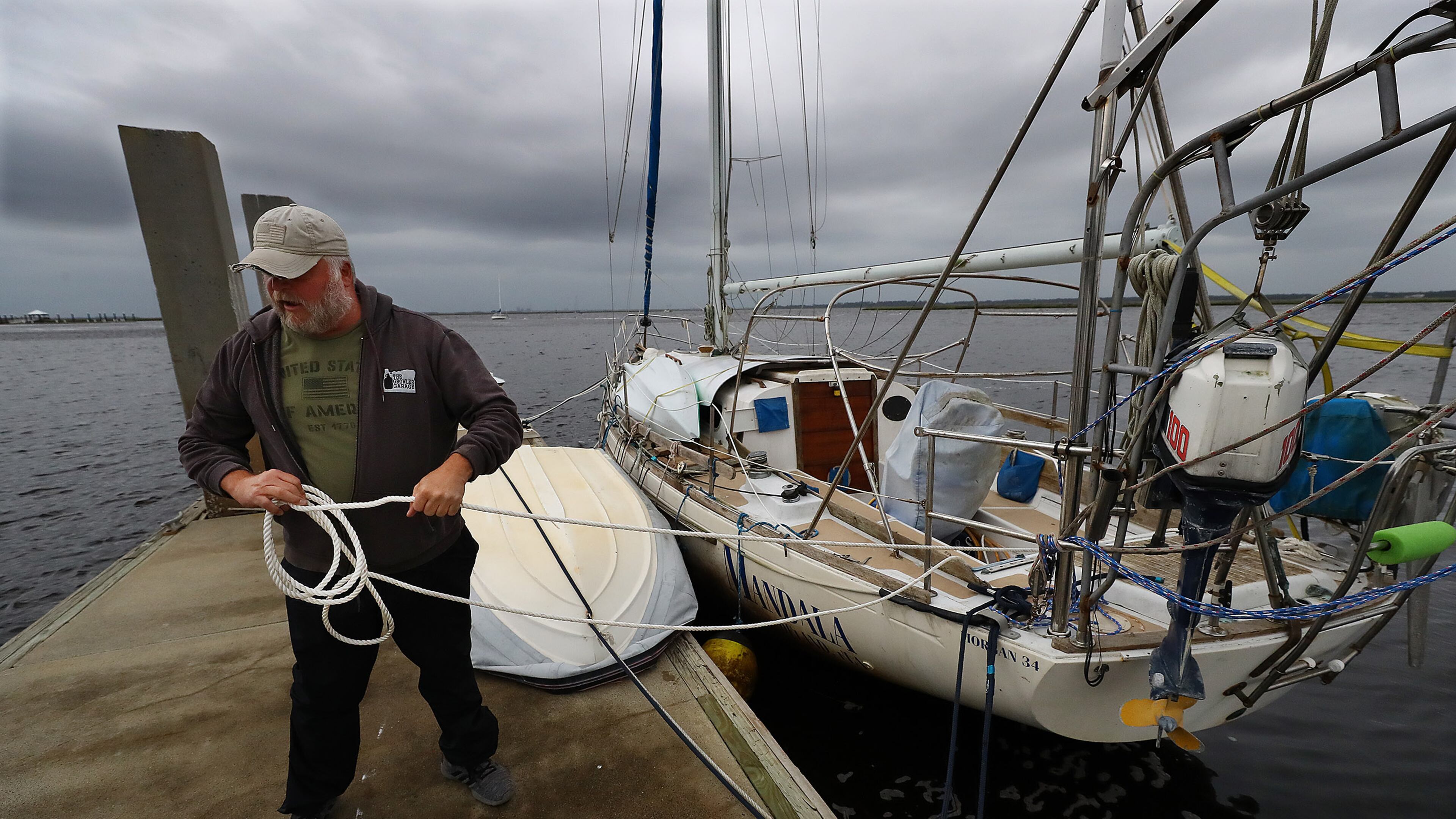 Dana Burchatz, 57, secures his 34-foot Morgan sailboat he recently purchased to the dock at Lang’s Marina hoping for the best while preparing for Hurricane Ian on Wednesday, Sept. 28, 2022, in St. Mary’s. Curtis Compton / Curtis Compton@ajc.com
