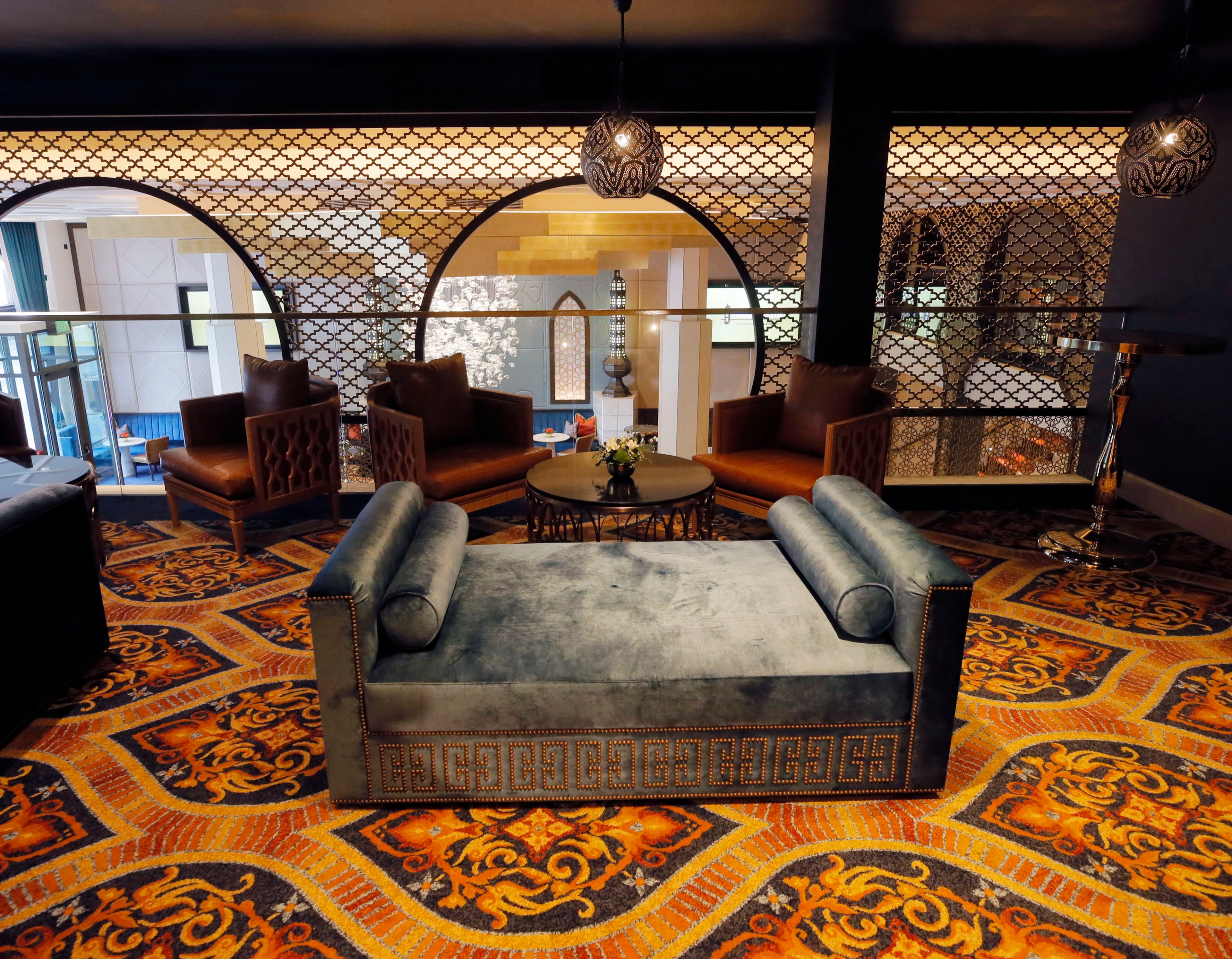 The Mezzanine Level overlooks the Main Level through a screen.