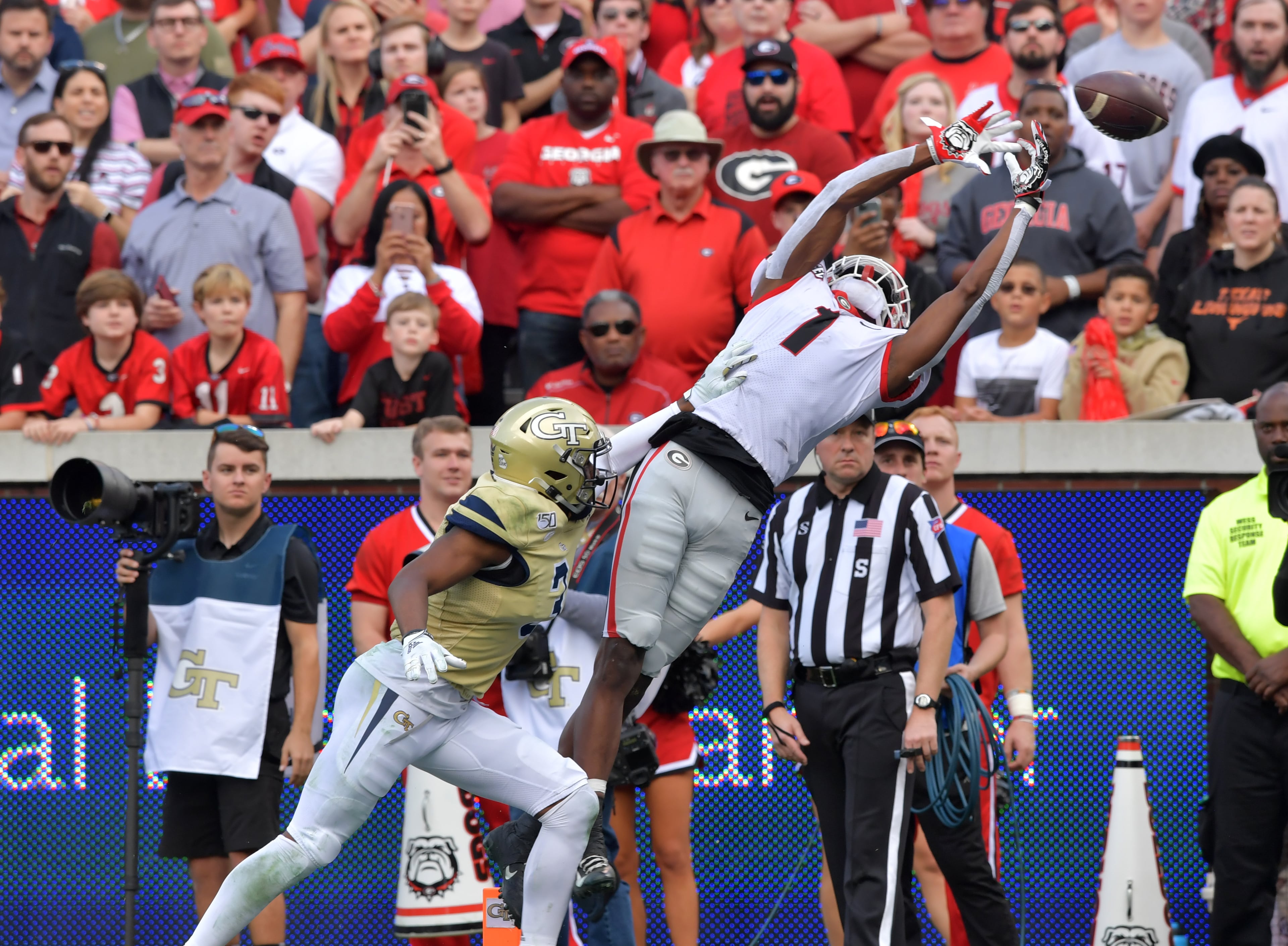 Georgia wide receiver George Pickens (1) is not able to catch a pass under pressure from Georgia Tech defensive back Tre Swilling (3) during the second half of an NCAA college football game at Bobby Dodd Stadium on Saturday, November 30, 2019. Georgia won 52-7 over the Georgia Tech. (Hyosub Shin / Hyosub.Shin@ajc.com)