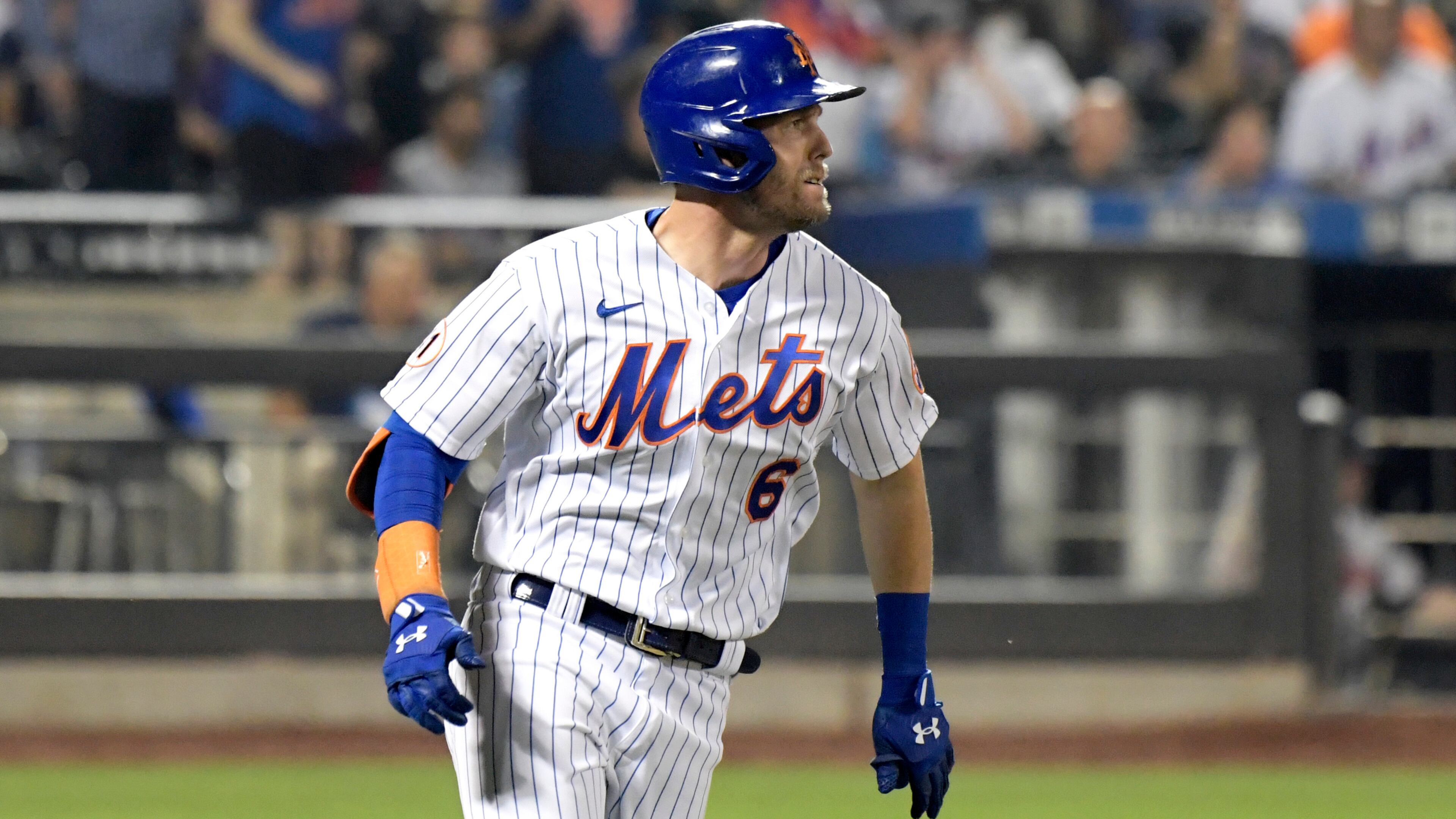Jeff McNeil rounds first and heads to second during his run-scoring double in the fifth inning of Monday's Game 2.