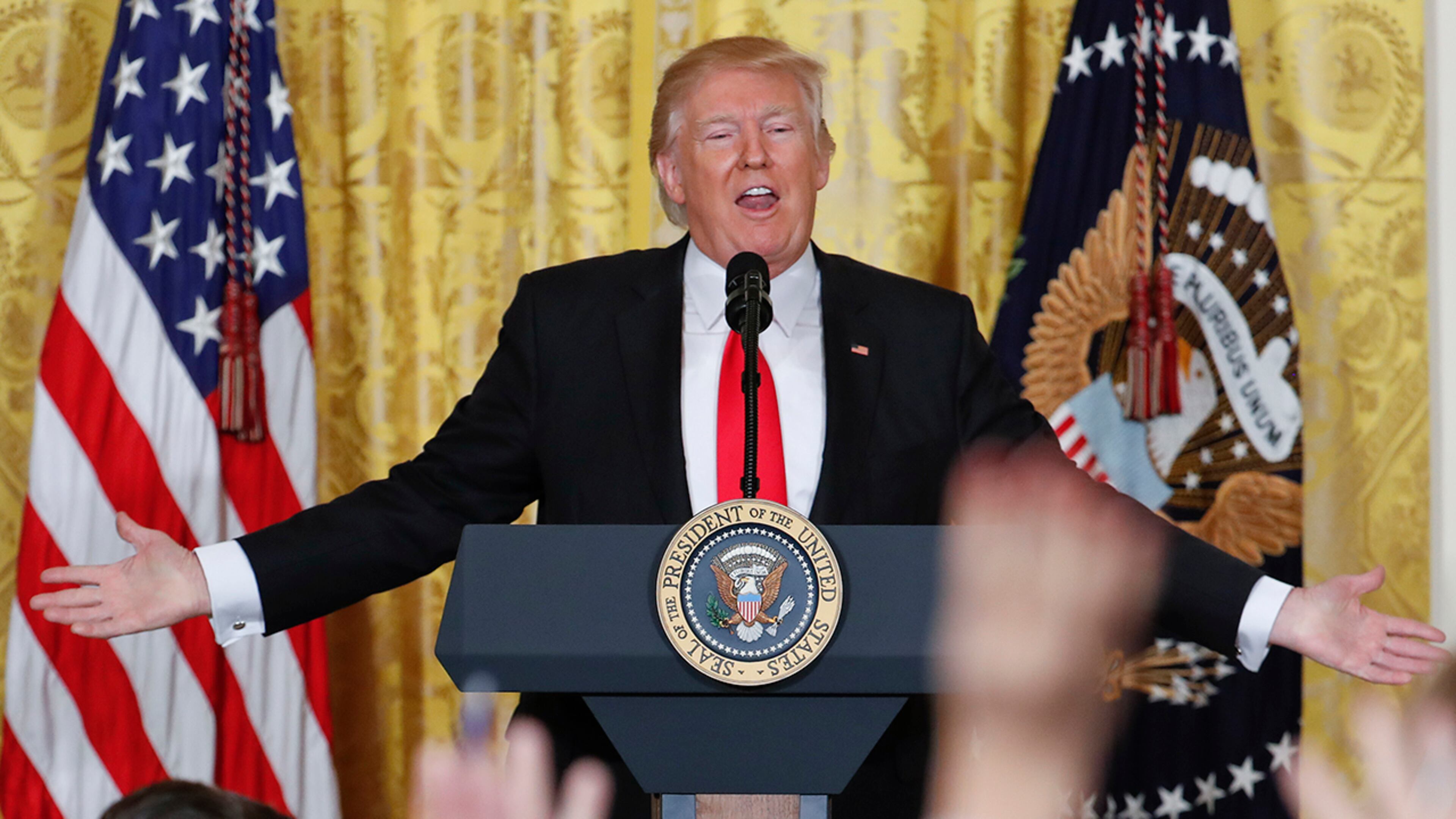 Reporters raise their hands as President Donald Trump fields questions during a news conference in the East Room of the White House in Washington, Thursday, Feb. 16, 2017. (AP Photo/Pablo Martinez Monsivais)