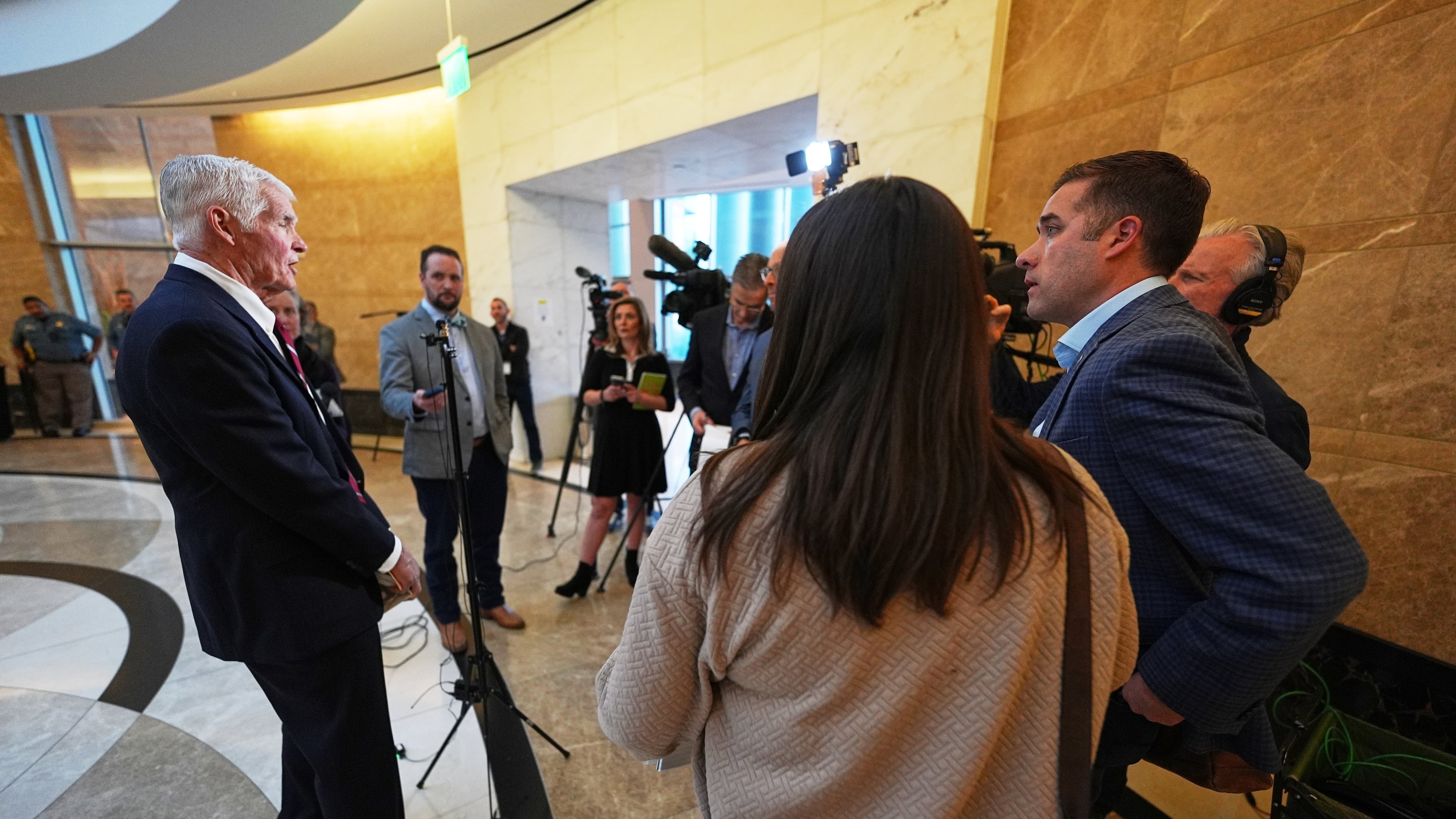 Attorney John Case, left, talks to reporters after a hearing to urge a state appeals court to overturn the convictions against former Colorado elections clerk and Donald Trump ally Tina Peters for orchestrating a data breach of her county's elections equipment Wednesday, Jan. 14, 2026, in Denver. (AP Photo/David Zalubowski)