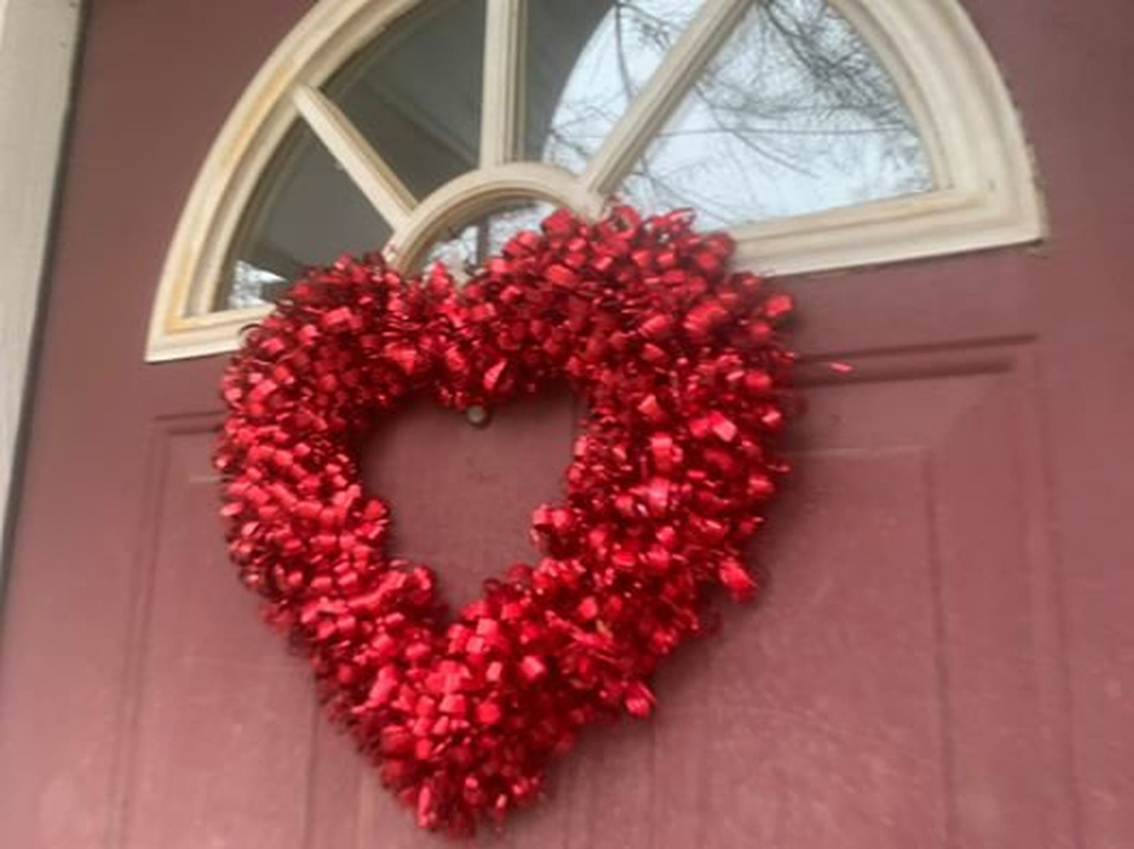 People across metro Atlanta have been hanging hearts and encouraging messages on windows, even as we all practice social distancing. (Contributed)