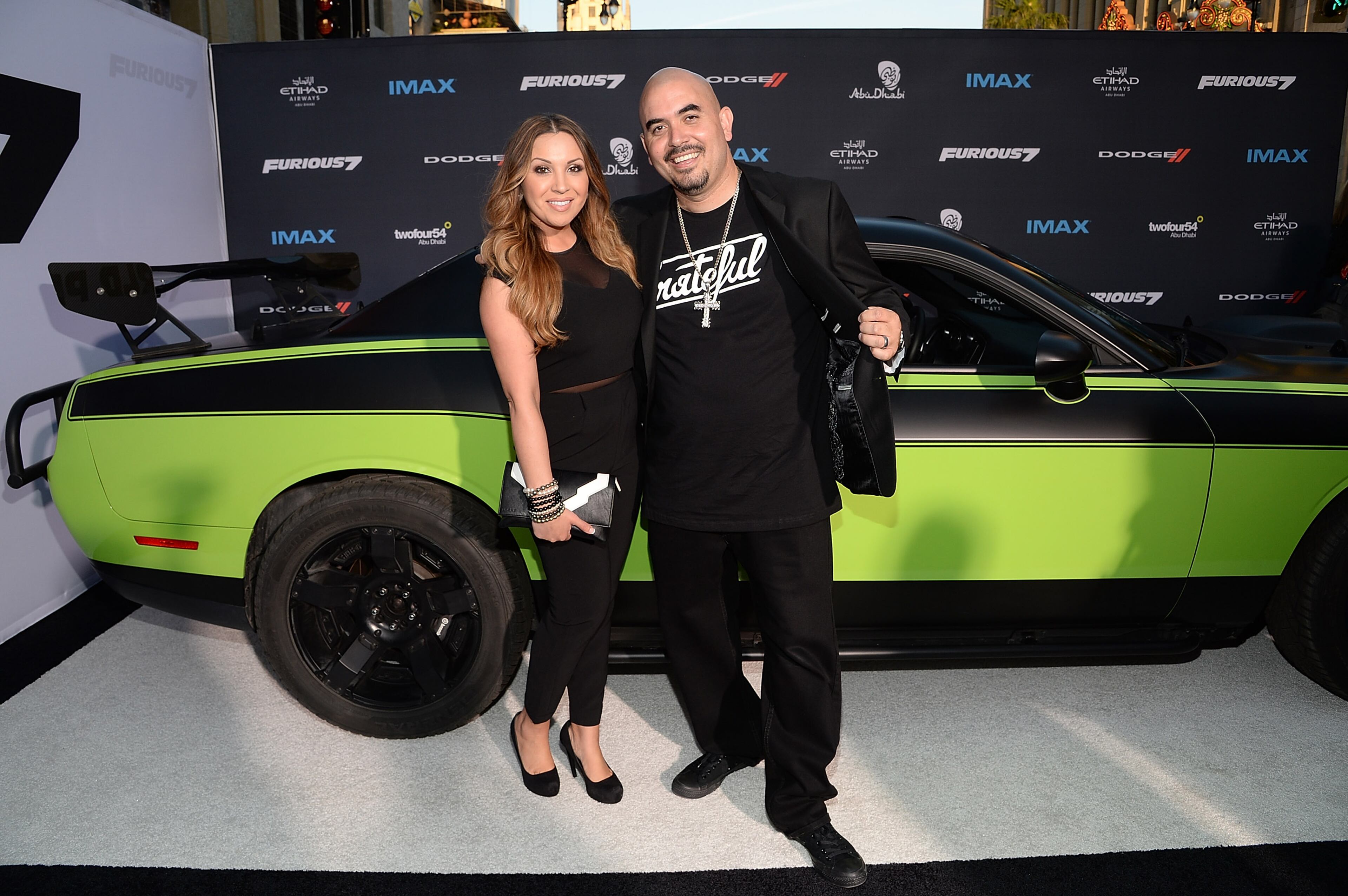 HOLLYWOOD, CA - APRIL 01: Actor Noel Gugliemi (R) and Tomasa Gugliemi attends the Furious 7 Los Angeles Premiere Sponsored by Dodge at TCL Chinese 6 Theatres on April 1, 2015 in Hollywood, California. (Photo by Michael Kovac/Getty Images for Dodge)