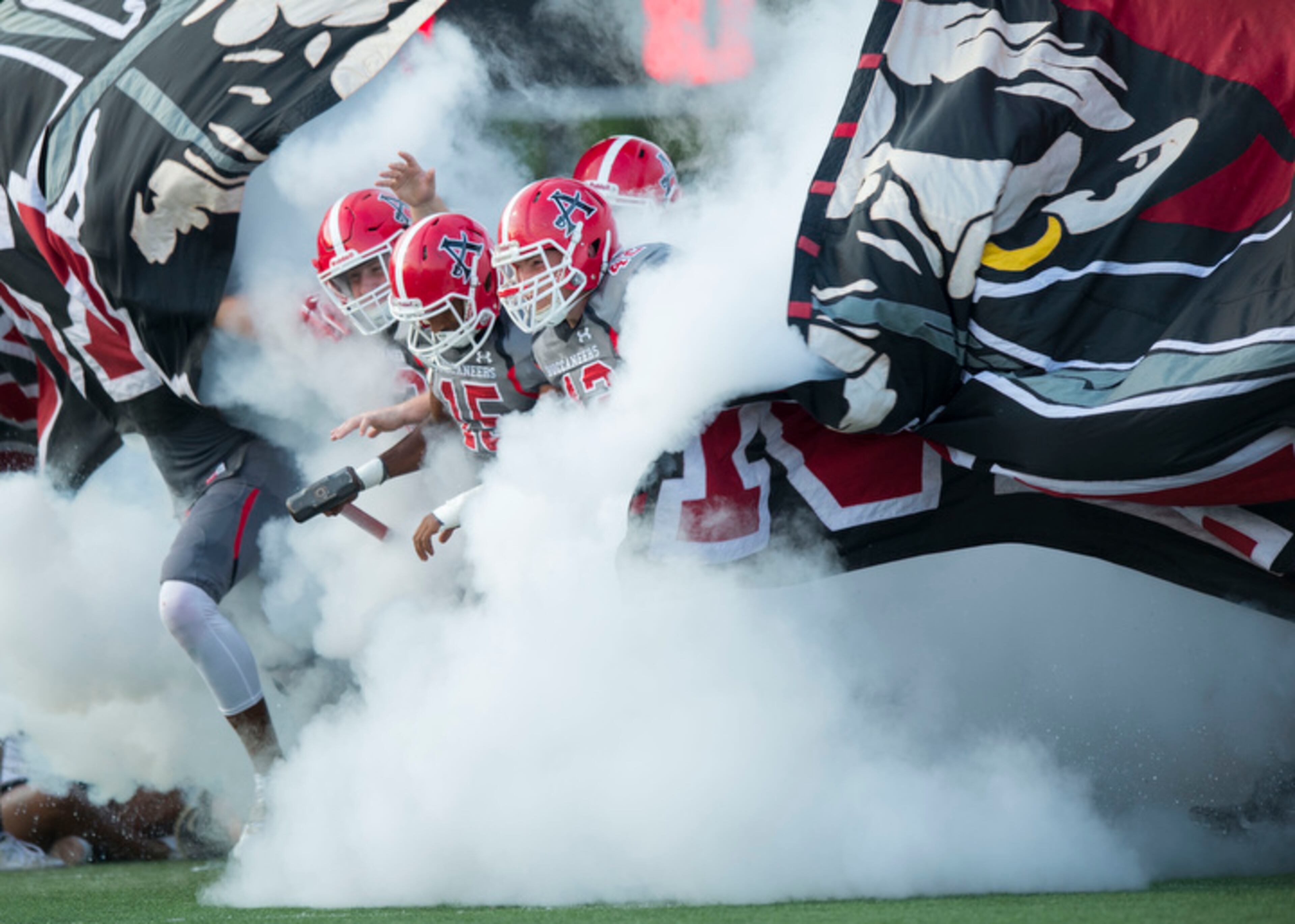 The Allatoona Buccaneers take the field before the start of their game against the Alexander Cougars at Allatoona Friday, August 25, 2017.