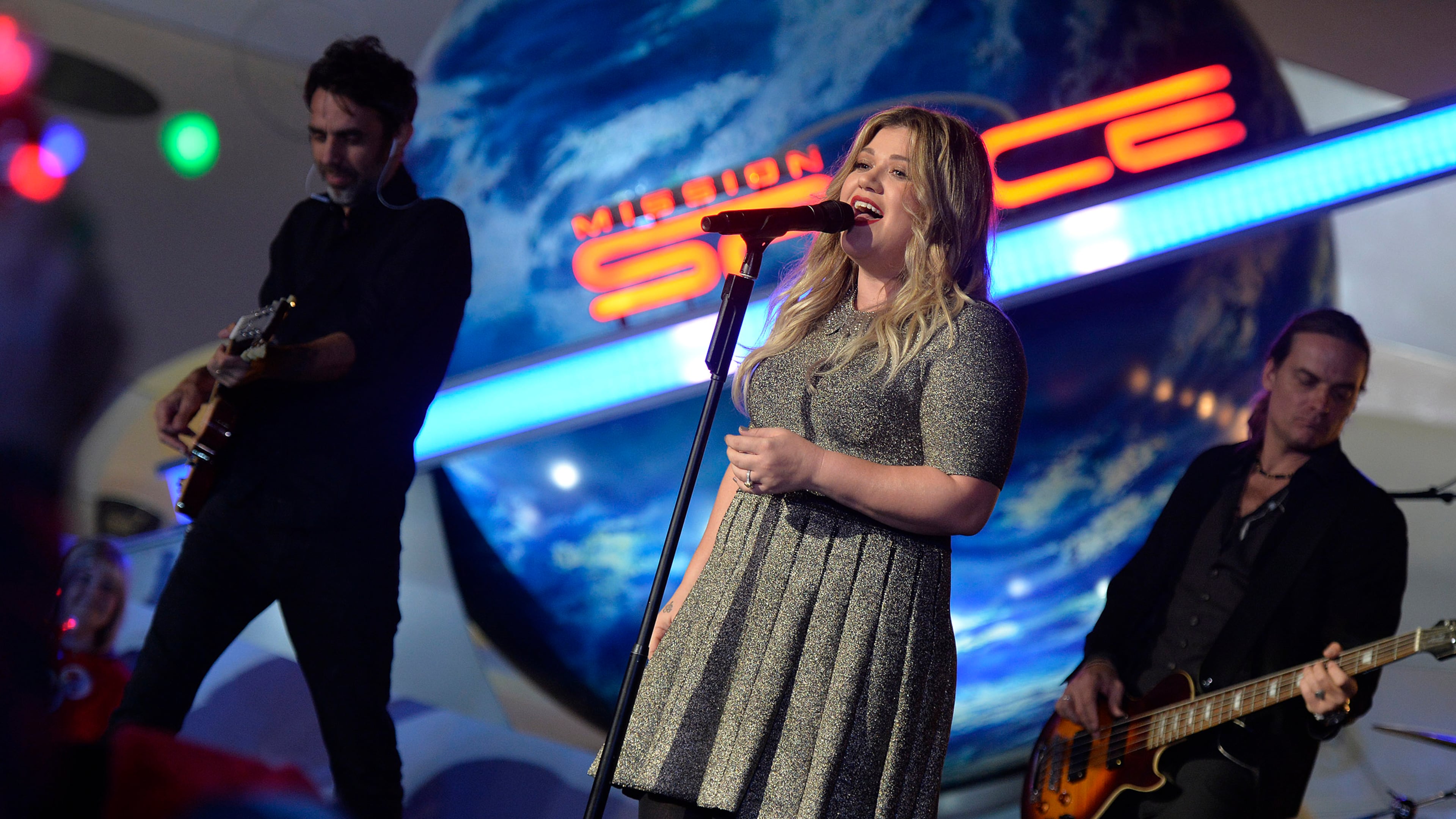 LAKE BUENA VISTA, FL - NOVEMBER 10: Grammy award-winning singer-songwriter Kelly Clarkson performs Nov. 10, 2016 while taping for one of three ABC and Disney Channel holiday TV specials, "The Wonderful World of Disney: Magical Holiday Celebration," "Disney Parks Presents: A Descendants Magical Holiday Celebration," and "The Disney Parks Magical Christmas Celebration" in Epcot at Walt Disney World Resort in Lake Buena Vista, Fla. The Thanksgiving and Christmas telecasts air nationwide on November 24, and December 25 on ABC-TV, and the Descendants holiday telecast airs November 25 on Disney Channel. (Photo by Mark Ashman/Disney Parks via Getty Images)