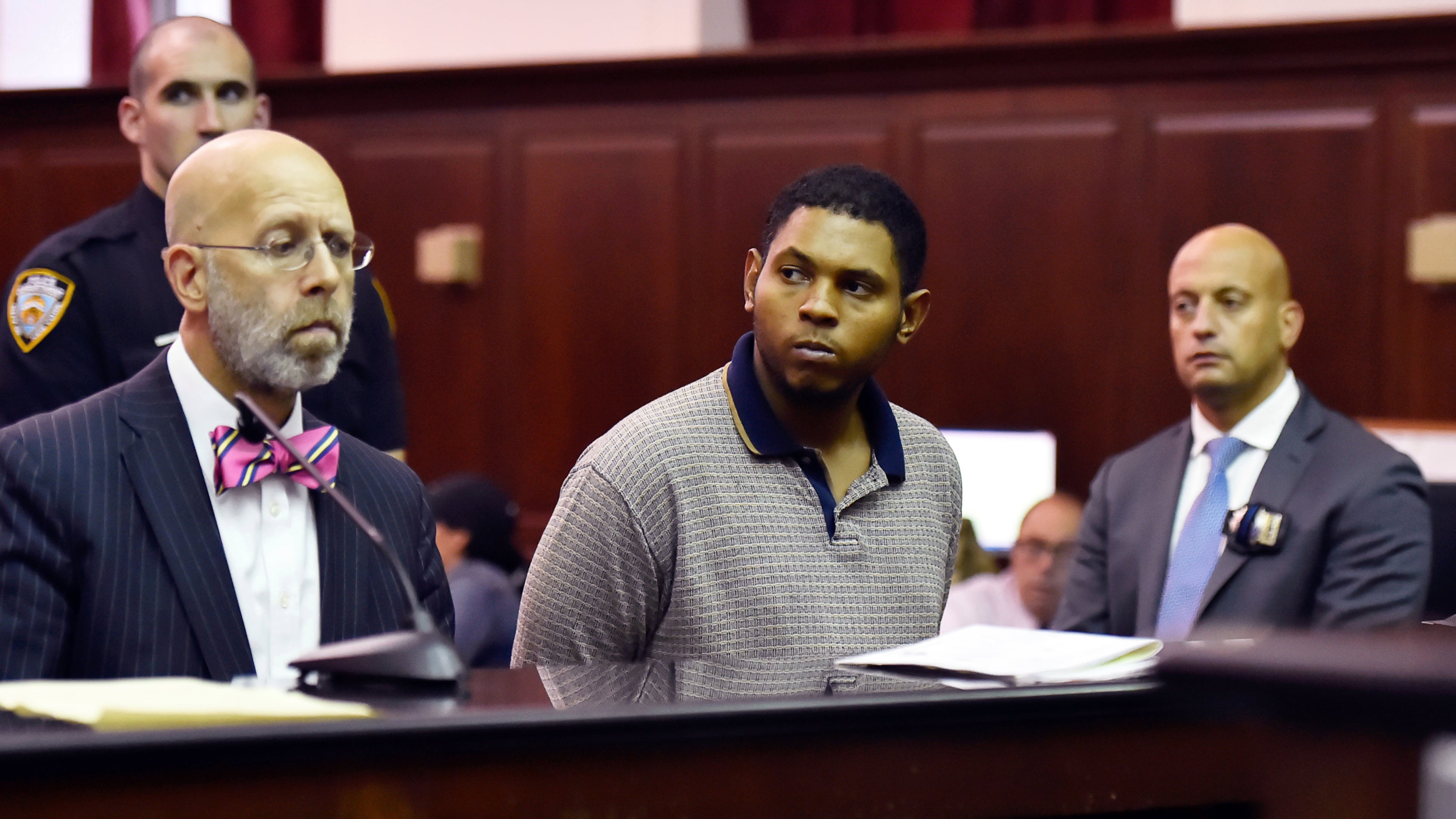 FILE - Randy Santos, center, is arraigned in criminal court for the murder of four homeless men, Oct. 6, 2019, in New York. (Rashid Umar Abbasi/New York Post via AP, Pool)