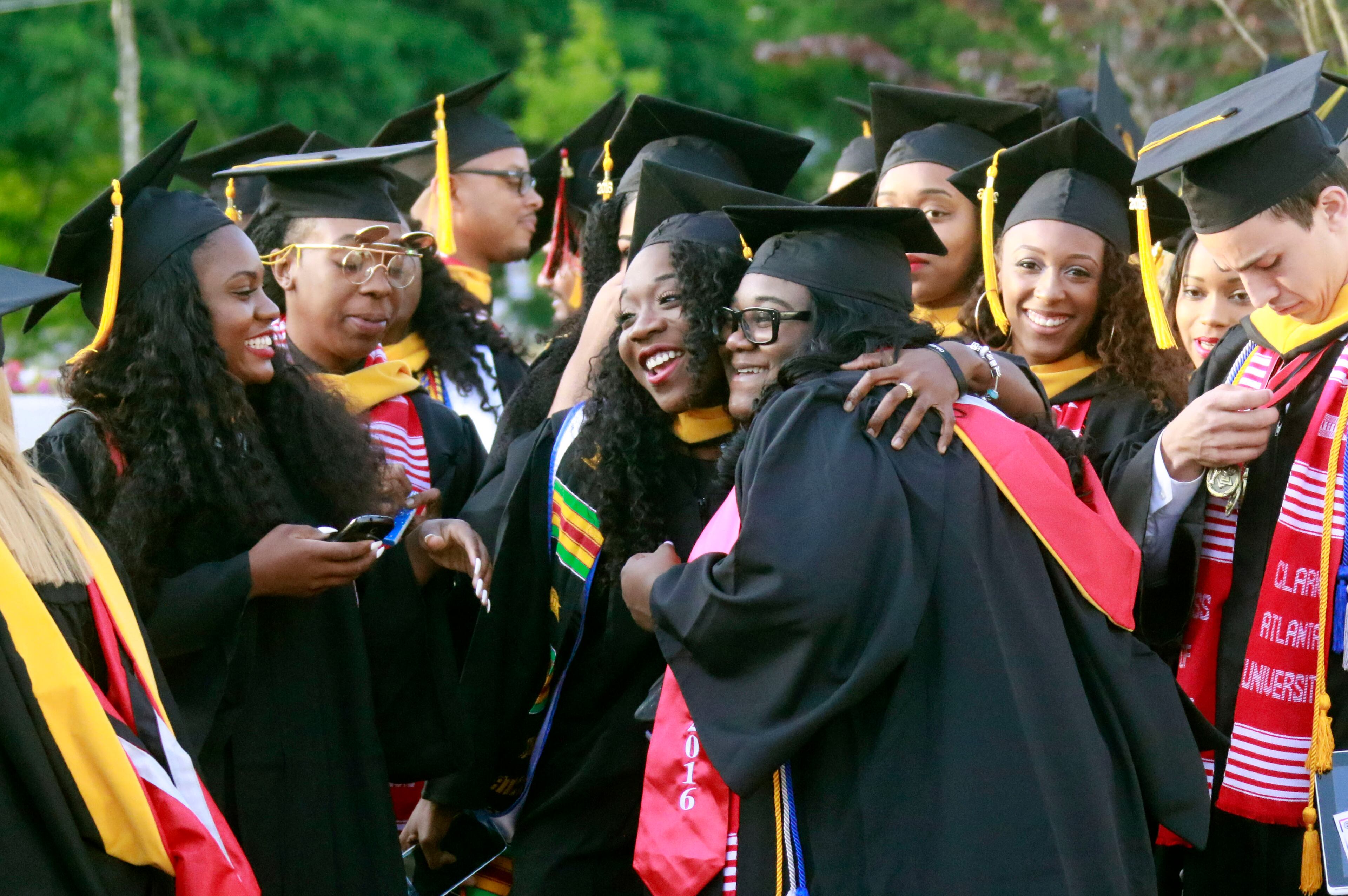 May 16, 2016 - Atlanta - Graduates celebrate as they line up for the processional. Clark Atlanta University class of 2016 filled Panther Stadium Monday morning for it's 27th annual Commencement Service. The keynote speaker was retired astronaut Mae Jemison, the first woman of color in Space. Honorary degrees were awarded to Hamilton Bohannon, a 1964 graduate of Clark College; Roland Carter; Congressman John Conyers, and Congressman Hank Johnson, a 1976 Clark College graduate. BOB ANDRES / BANDRES@AJC.COM