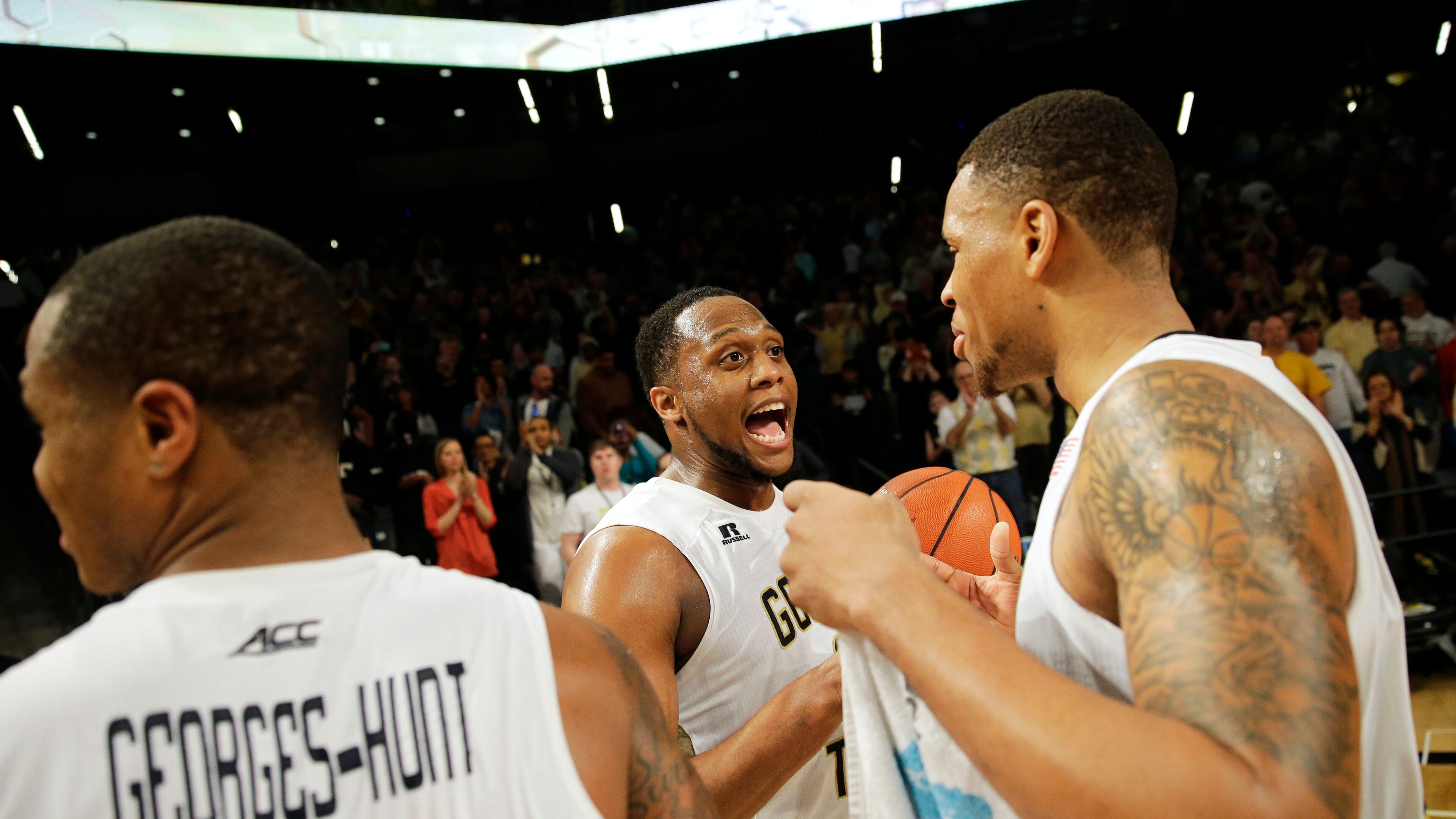 Georgia Tech's Nick Jacobs, right, celebrates with teammate Charles Mitchell after Tech beat Pittsburgh 63-59 in an NCAA college basketball game Saturday, March 5, 2016, in Atlanta. (AP Photo/David Goldman)