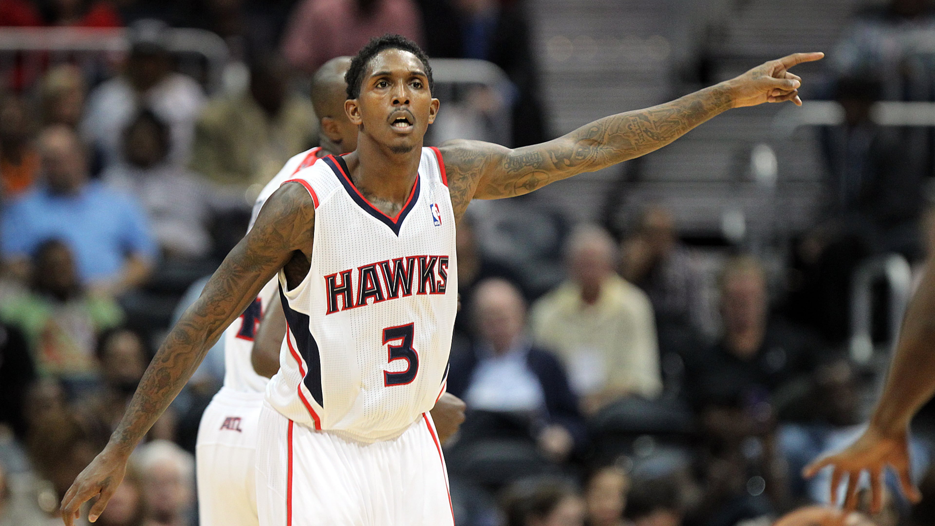 Hawks guard Lou Williams calls a defense against the Miami Heat during the first half of the exhibition opener at Philips Arena in Atlanta on Sunday , Oct. 7, 2012. CURTIS COMPTON / CCOMPTON@AJC.COM