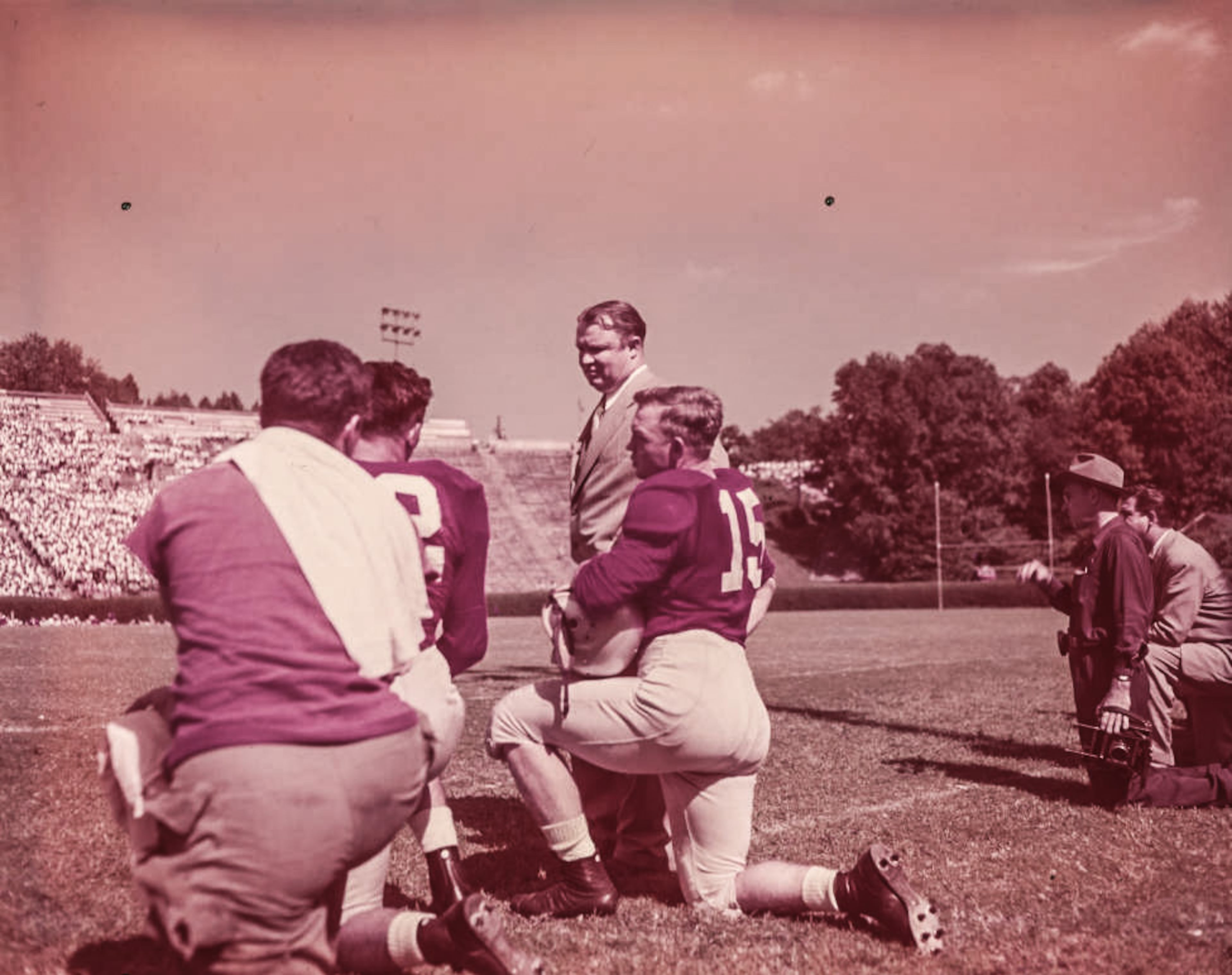 Georgia Bulldogs' coach Wally Butts addresses his players on the sideline in 1950.