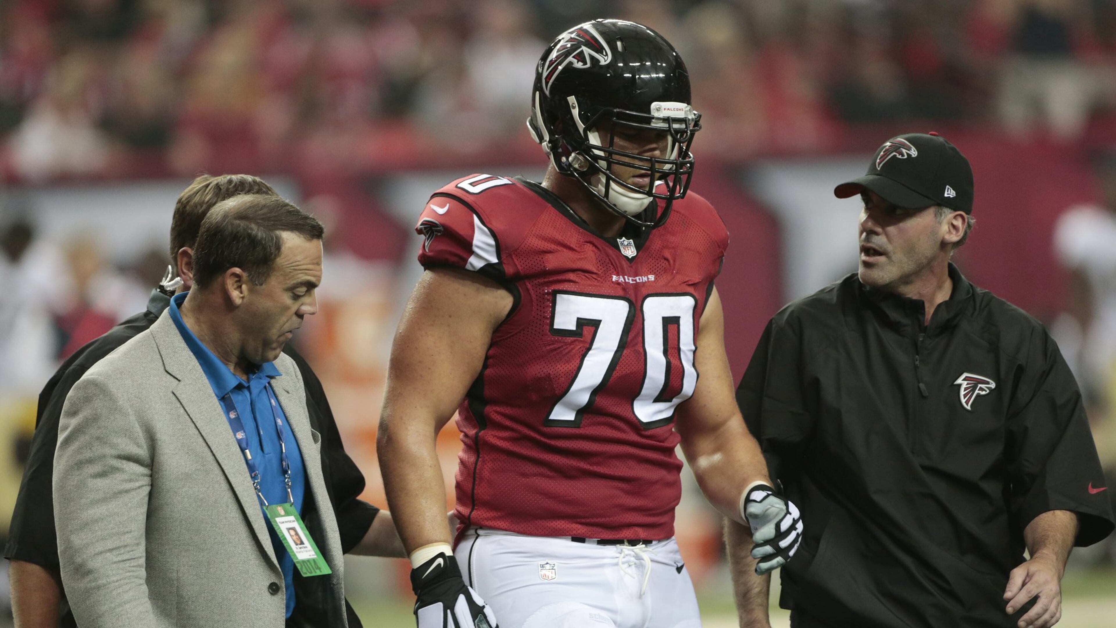 Atlanta Falcons offensive tackle Jake Matthews (70) walks off the field after being injured against the New Orleans Saints during the first half of an NFL football game, Sunday, Sept. 7, 2014, in Atlanta. (AP Photo/John Bazemore)