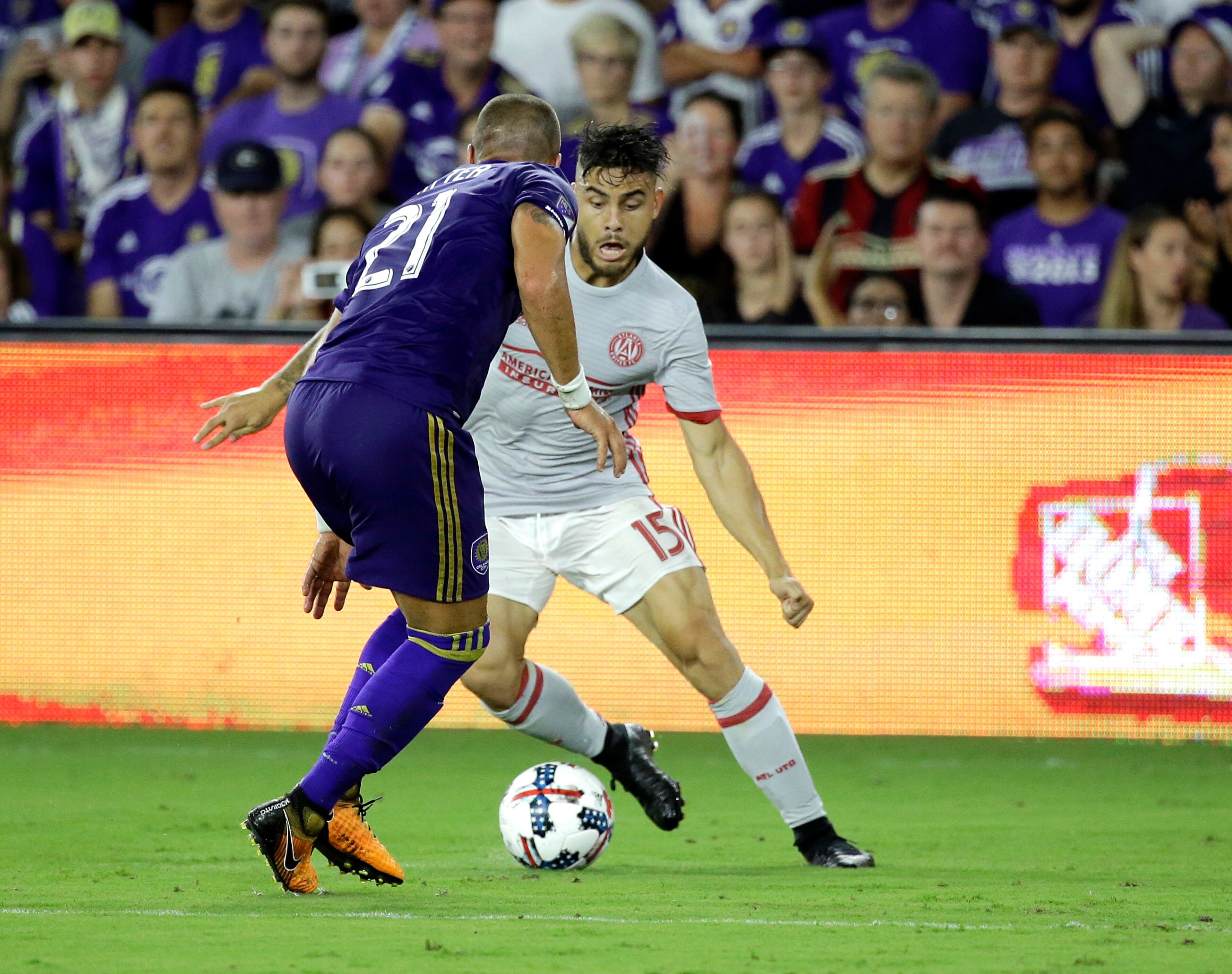 Atlanta United's Hector Villalba (15) makes a move to get around Orlando City's Antonio Nocerino (23) during the second half of an MLS soccer match, Friday, July 21, 2017, in Orlando, Fla. Atlanta United won 1-0. (AP Photo/John Raoux)