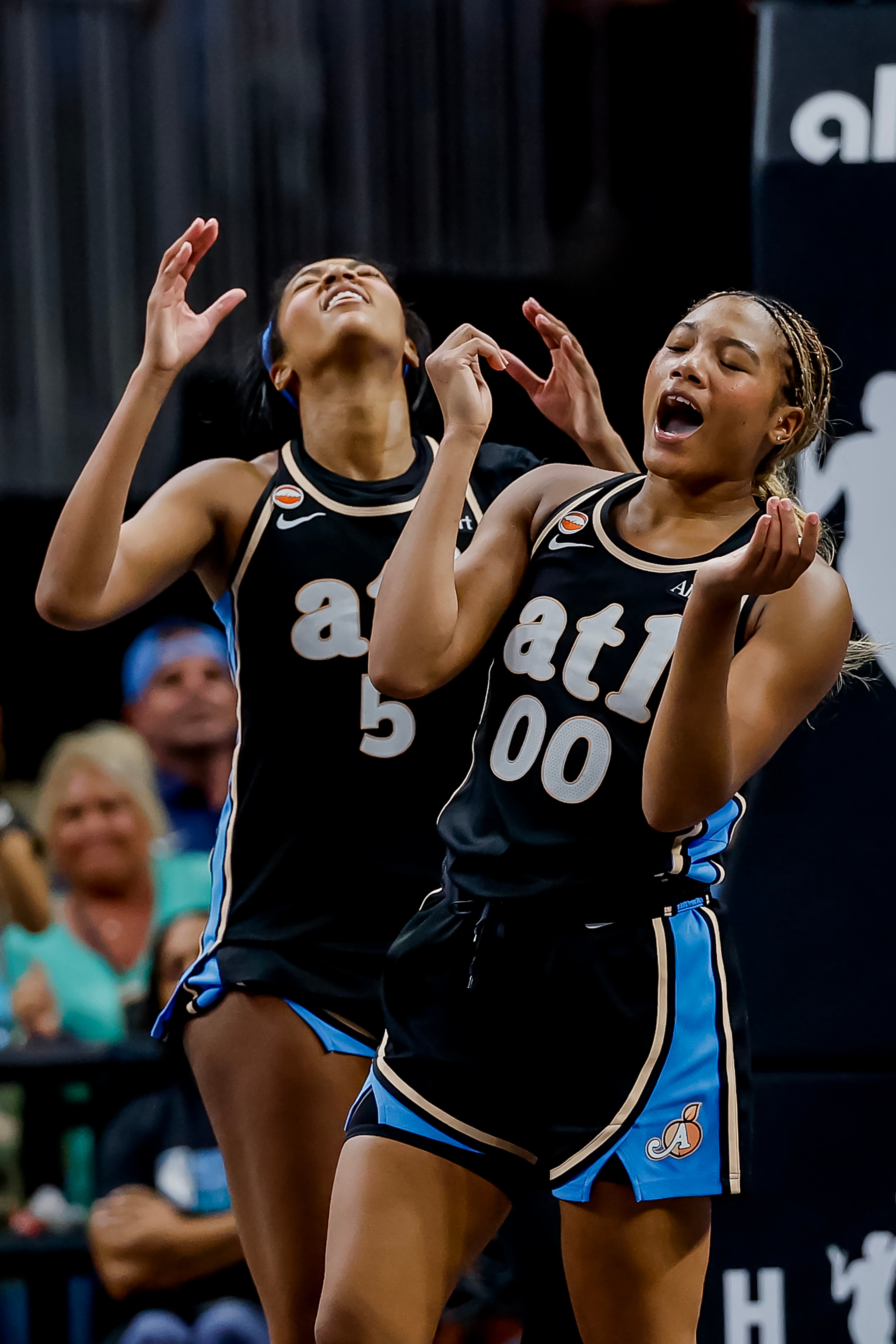 Reese and Hillmon react after missing a shot at the end of regulation. (Erik S. Lesser for the AJC)