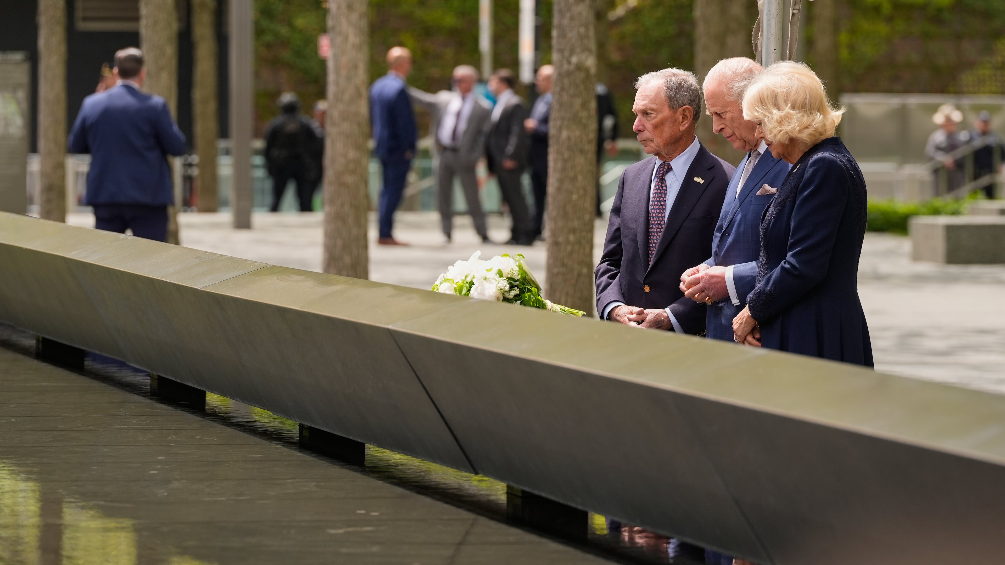 Former New York City mayor Michael Bloomberg, from left, Britain's King Charles III and Queen Camilla visit the 9/11 Memorial, Wednesday, April 29, 2026, in New York. (AP Photo/Seth Wenig)