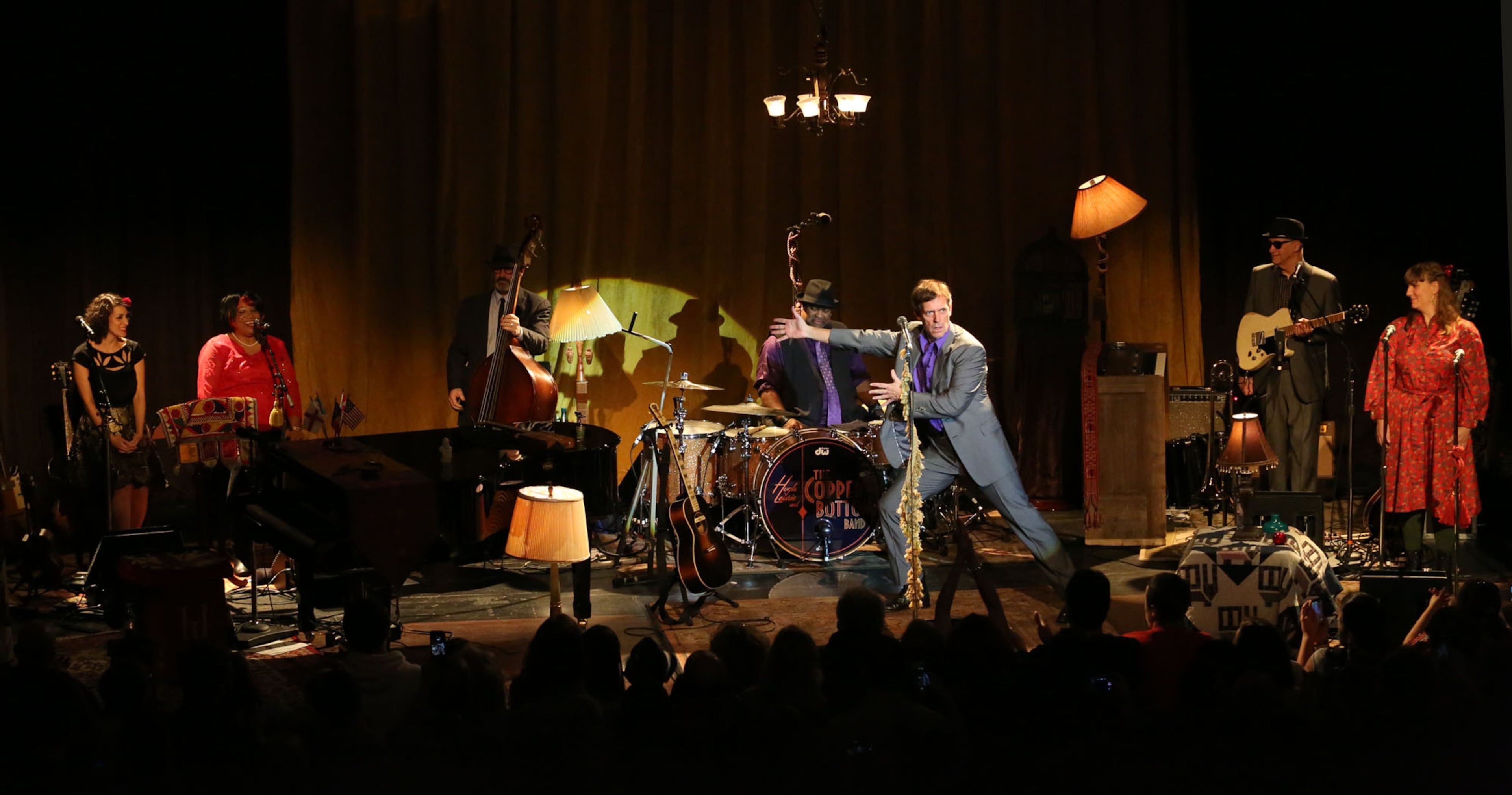 Hugh Laurie introduces the Copper Bottom Band accompanying him performing a blues musical Sunday, Nov. 3, 2013 at the Buckhead Theatre in Atlanta.