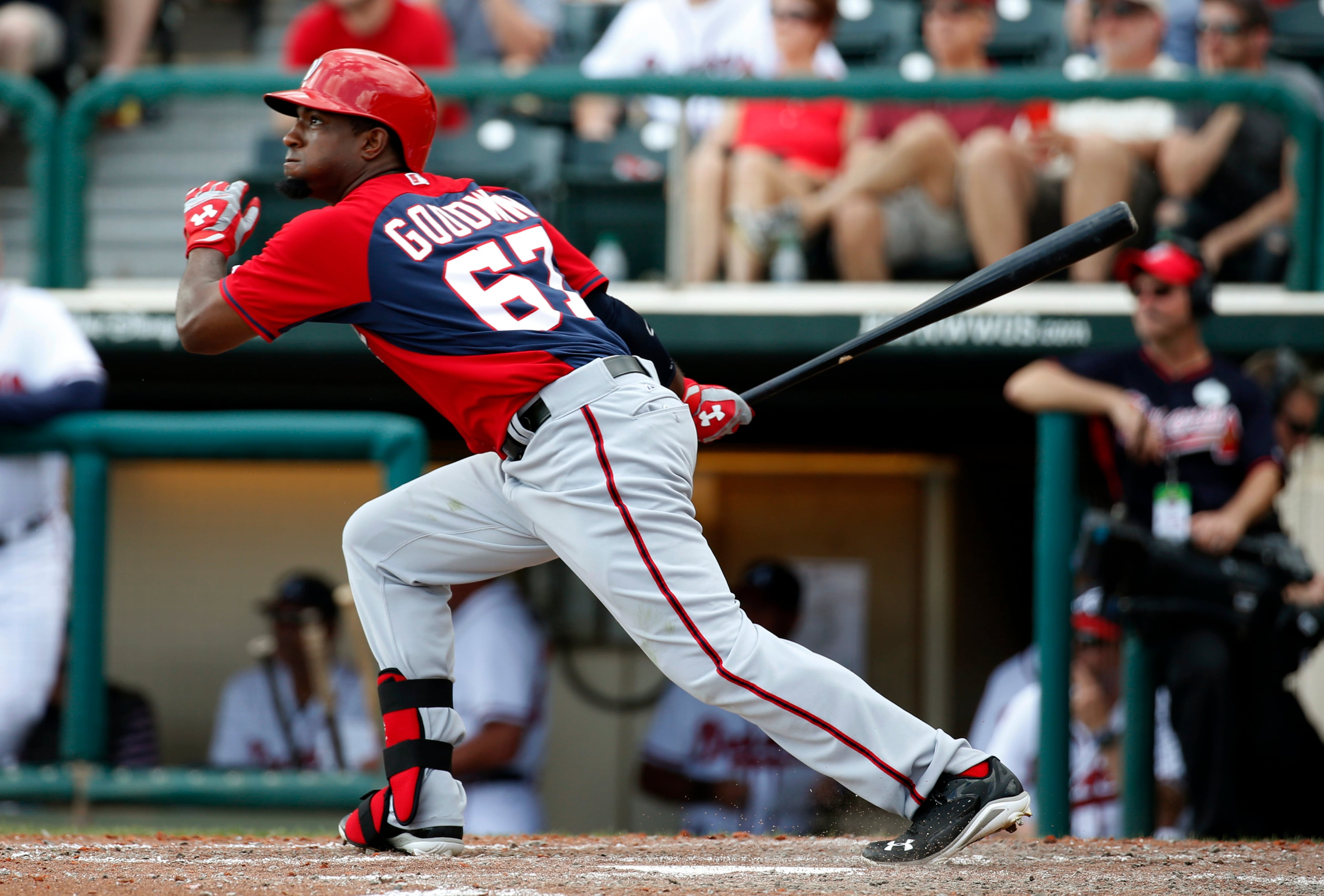 Washington Nationals' Brian Goodwin hits a double in the seventh inning of an exhibition baseball game against the Atlanta Braves, Tuesday, March 4, 2014, in Kissimmee, Fla. The Braves won 8-4.