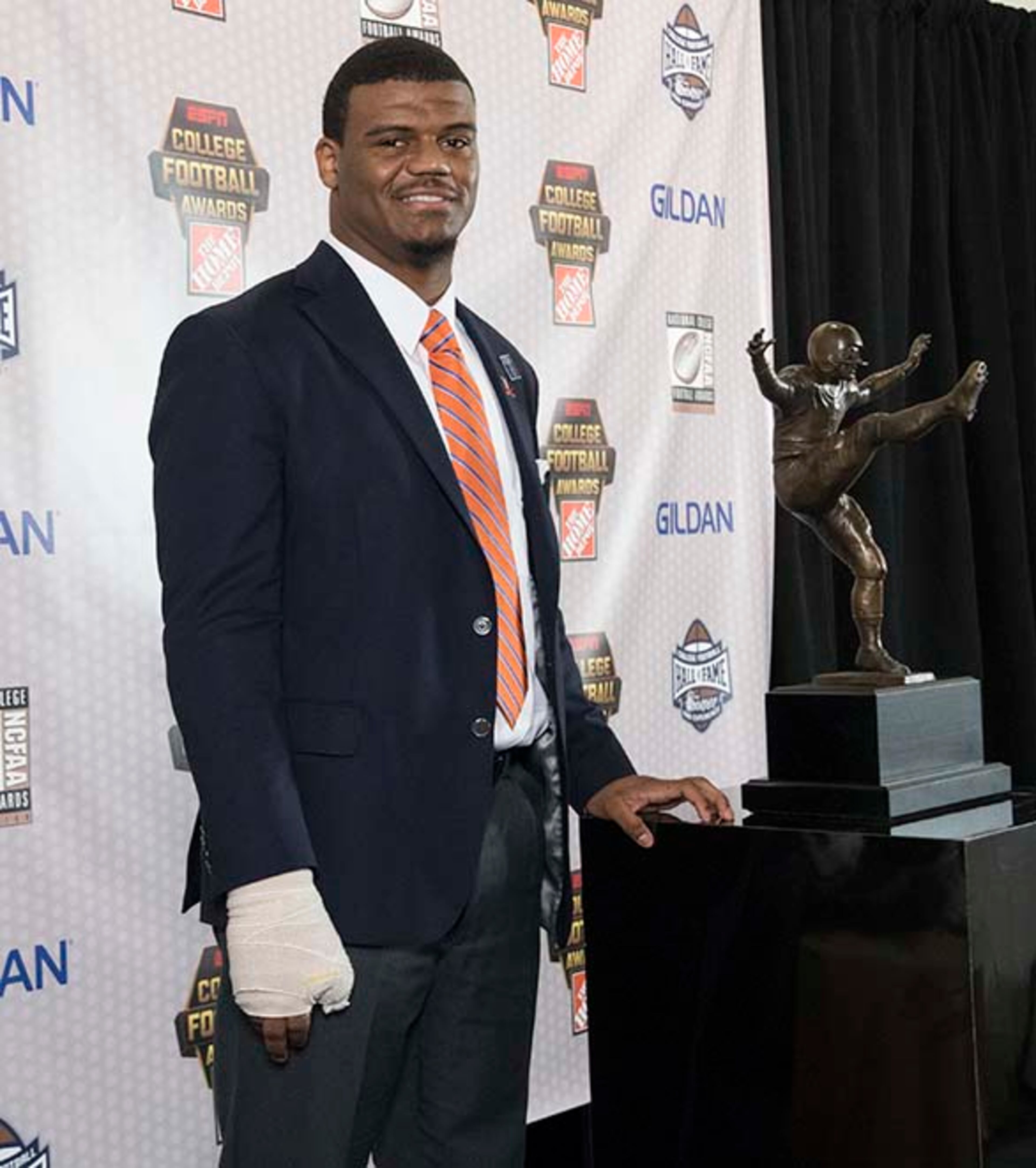 Virginia linebacker Micah Kiser, winner of the William V. Campbell Award honoring academic excellence, poses with the trophy during the College Football Awards show at the College Football Hall of Fame, Thursday, Dec. 7, 2017, in Atlanta.