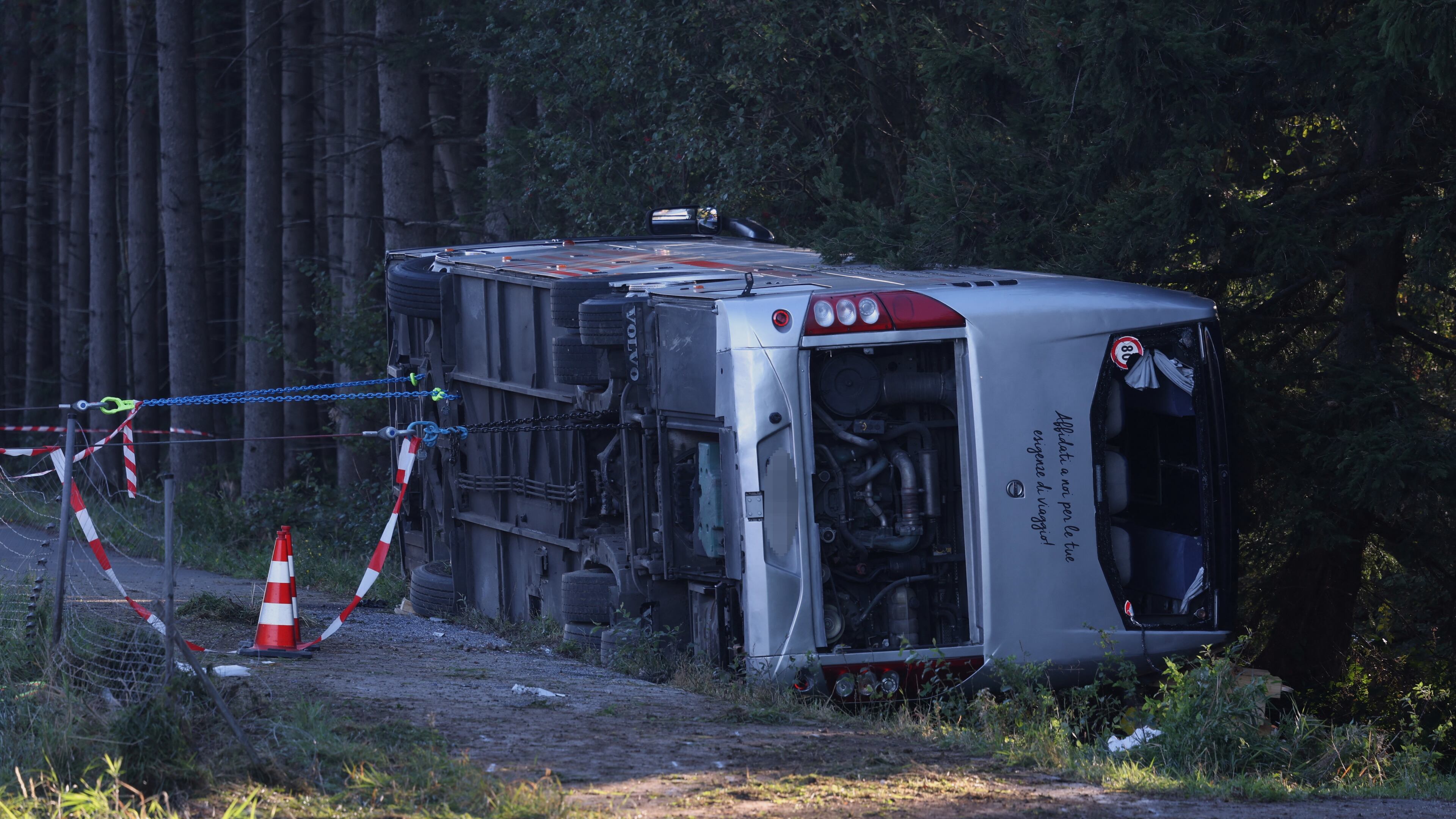 A view of the scene after a tourist bus veered off a highway, in Buchloe, Germany, Sunday, Sept. 27, 2026. (Karl-Josef Hildenbrand/dpa via AP)