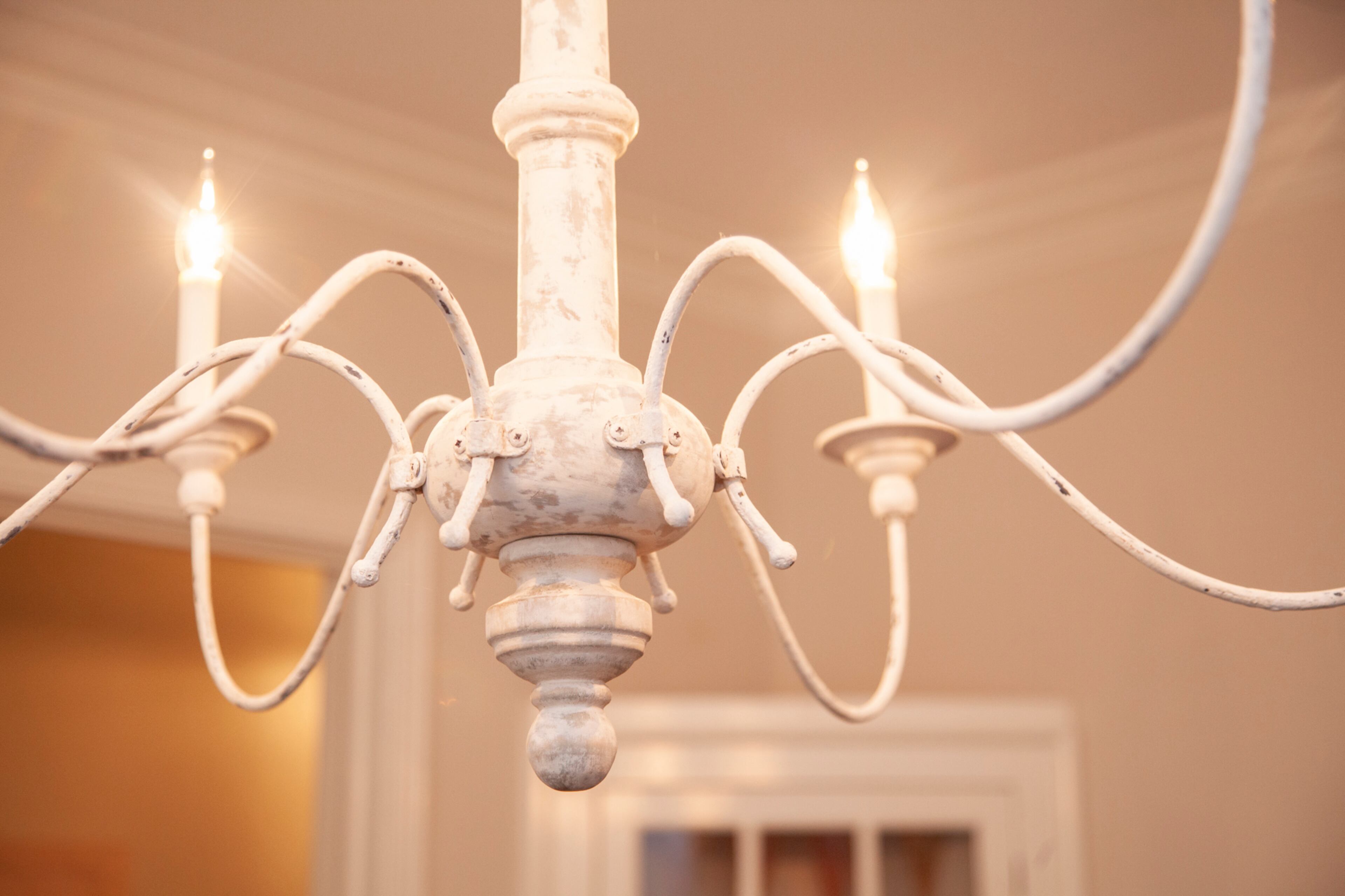 A chandelier from Circa Lighting adds farmhouse flair to the dining room.